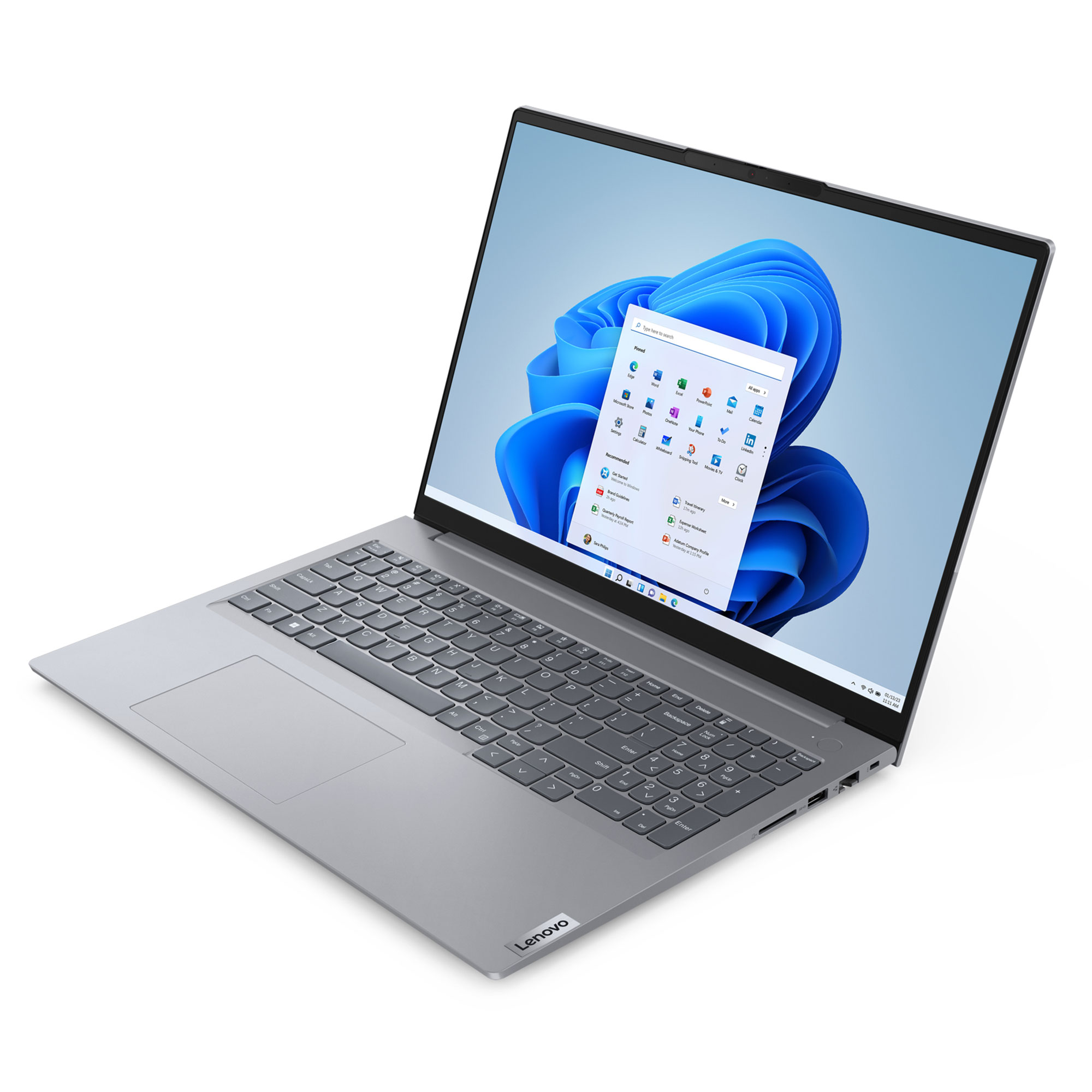Gümüş renkli bir Lenovo dizüstü bilgisayar, Windows 11'i gösteriyor. Ekran uygulama simgelerini gösteriyor. Klavye ve dokunmatik yüzey görünür.