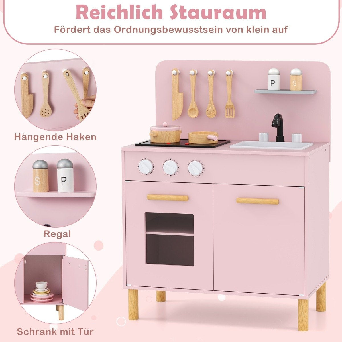Una cocina de juguete de madera rosa. Incluye una estufa, fregadero, armarios, utensilios colgantes y estantes con saleros y pimenteros.