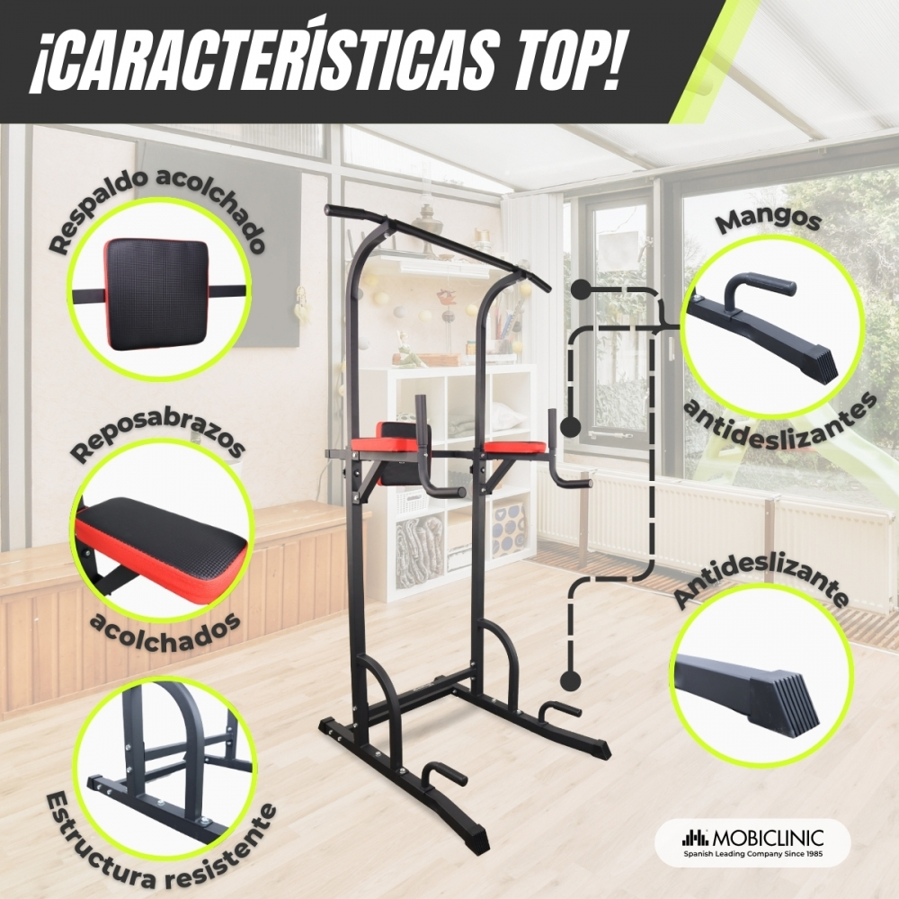 Equipo de ejercicio negro y rojo, etiquetado con características como respaldo acolchado, reposabrazos y asas antideslizantes, en interiores.