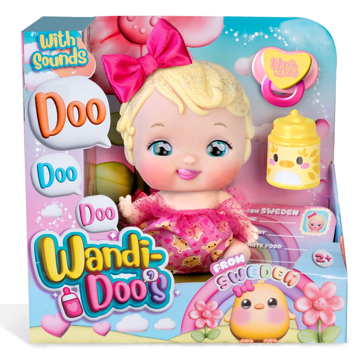 Una muñeca bebé en una caja, con un lazo rosa, chupete y biberón. La caja dice 'Wandi-Doo's' y 'From Sweden'.