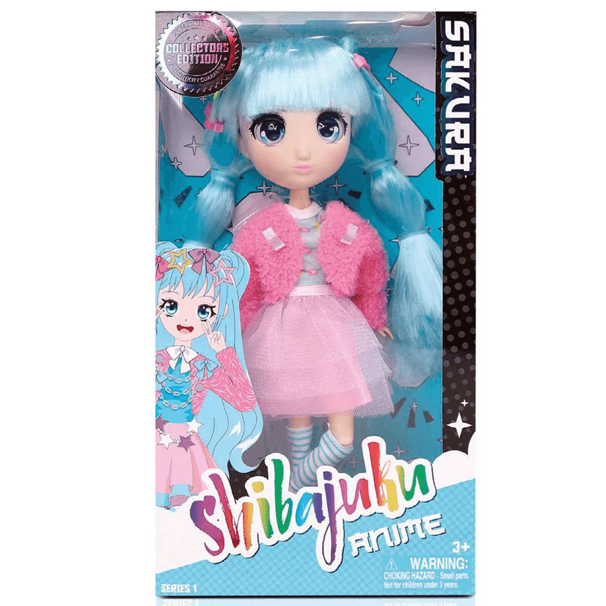 Una muñeca en una caja. La muñeca tiene cabello azul, una chaqueta rosa y una falda rosa. La caja está etiquetada como 'Shibajuku Anime'.
