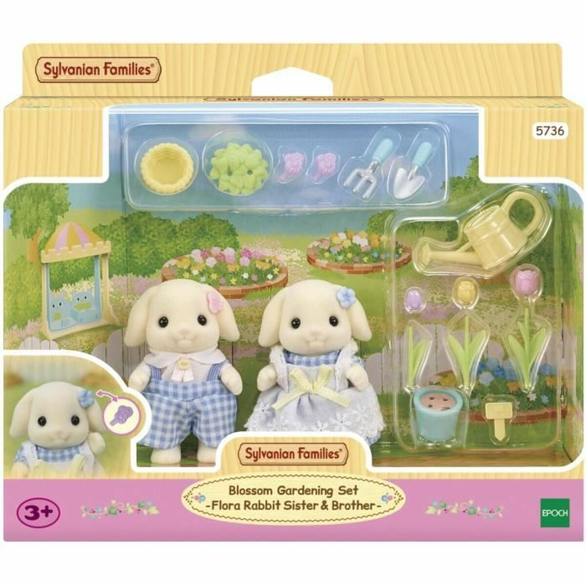 Un juego de jardinería Sylvanian Families Blossom. Presenta dos figuras de conejos, herramientas de jardinería y decoraciones florales. El fondo muestra un jardín.