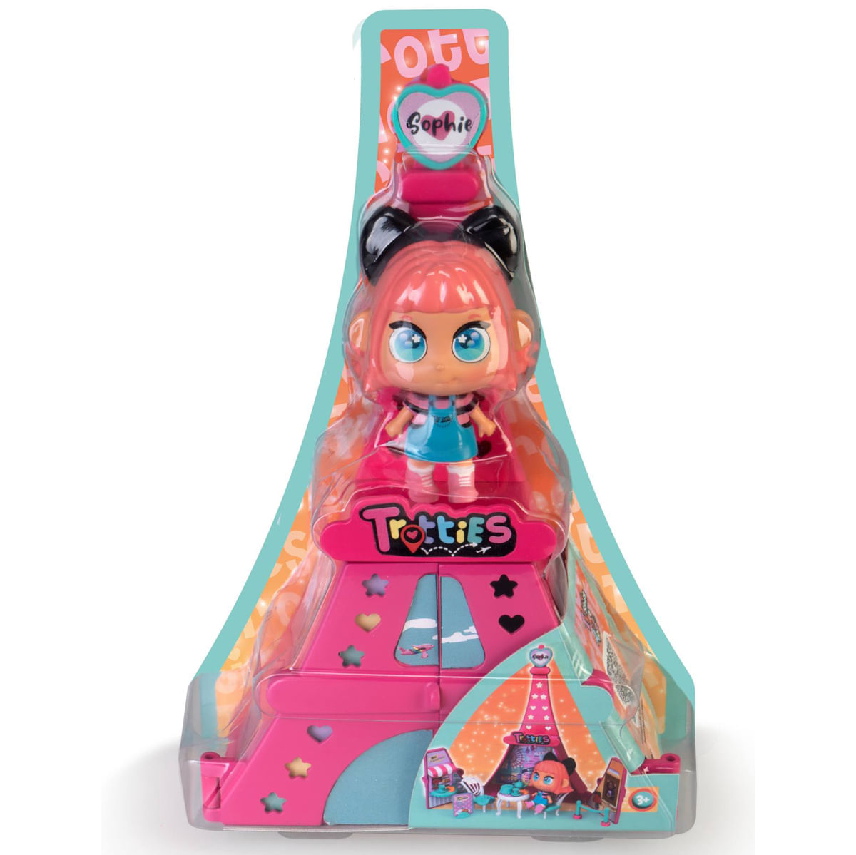 Una muñeca Totties llamada Sophie en un juego rosa. El embalaje es de plástico transparente. Se ven colores rosa, azul y naranja.