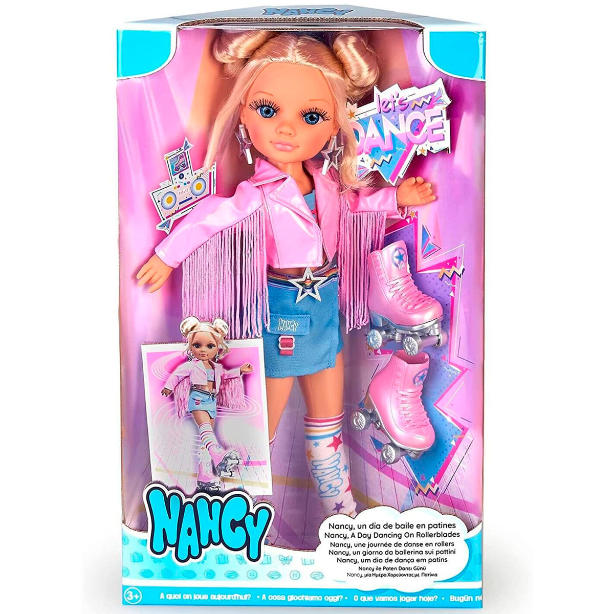 Muñeca Nancy en caja, con atuendo rosa y patines. La caja dice "Nancy" y "Let's Dance".