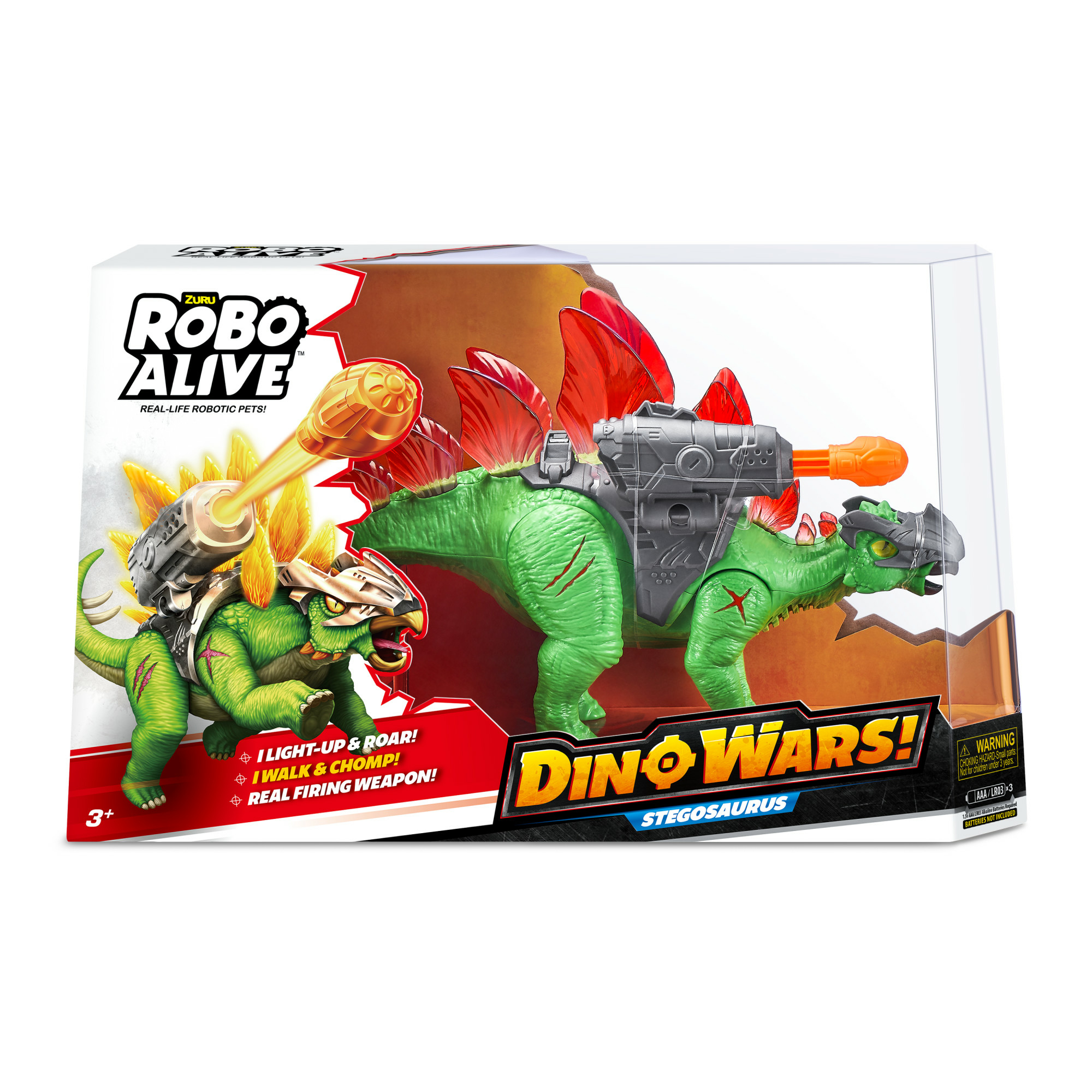Dinosaurio de juguete en caja. Estegosaurio verde con una pistola. La caja tiene texto: Dino Wars, Robo Alive.