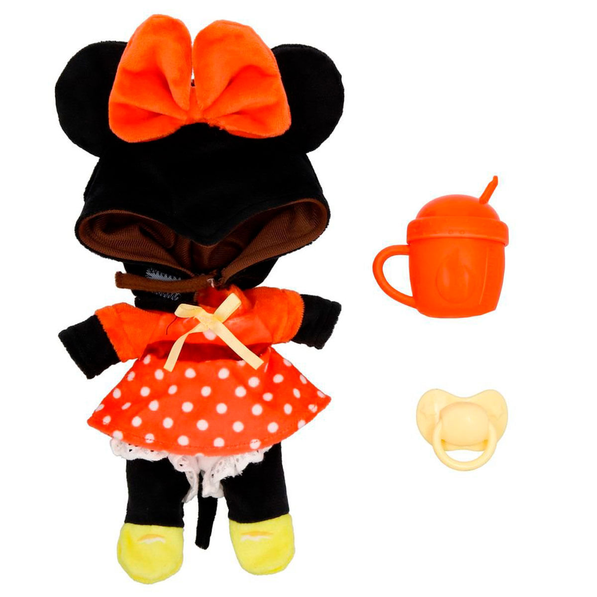 Una muñeca de Minnie Mouse con un vestido de lunares, lazo y orejas. Incluye una taza y un chupete.