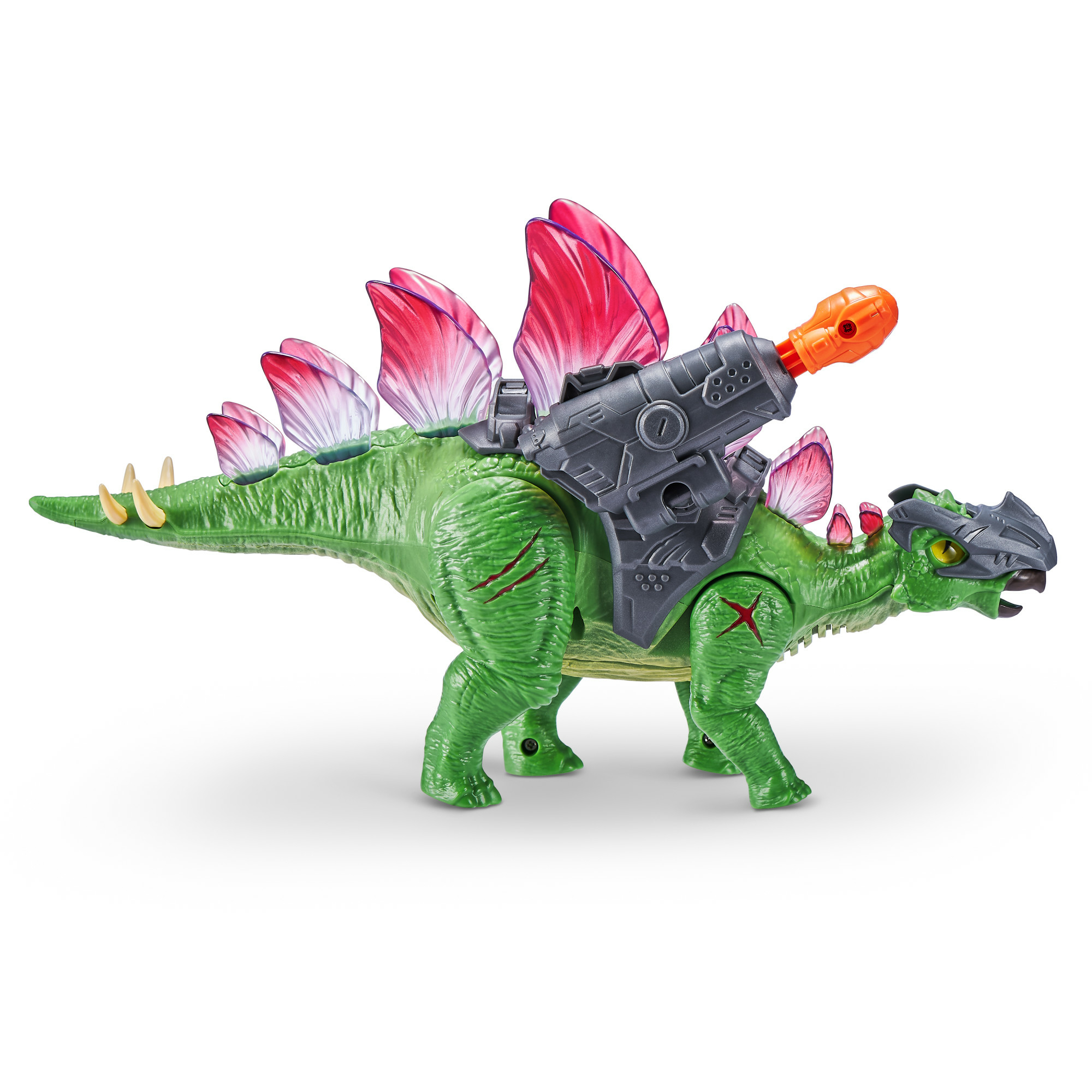 Un dinosaurio de juguete verde con placas rojas y rosas en la espalda y un arma gris encima.