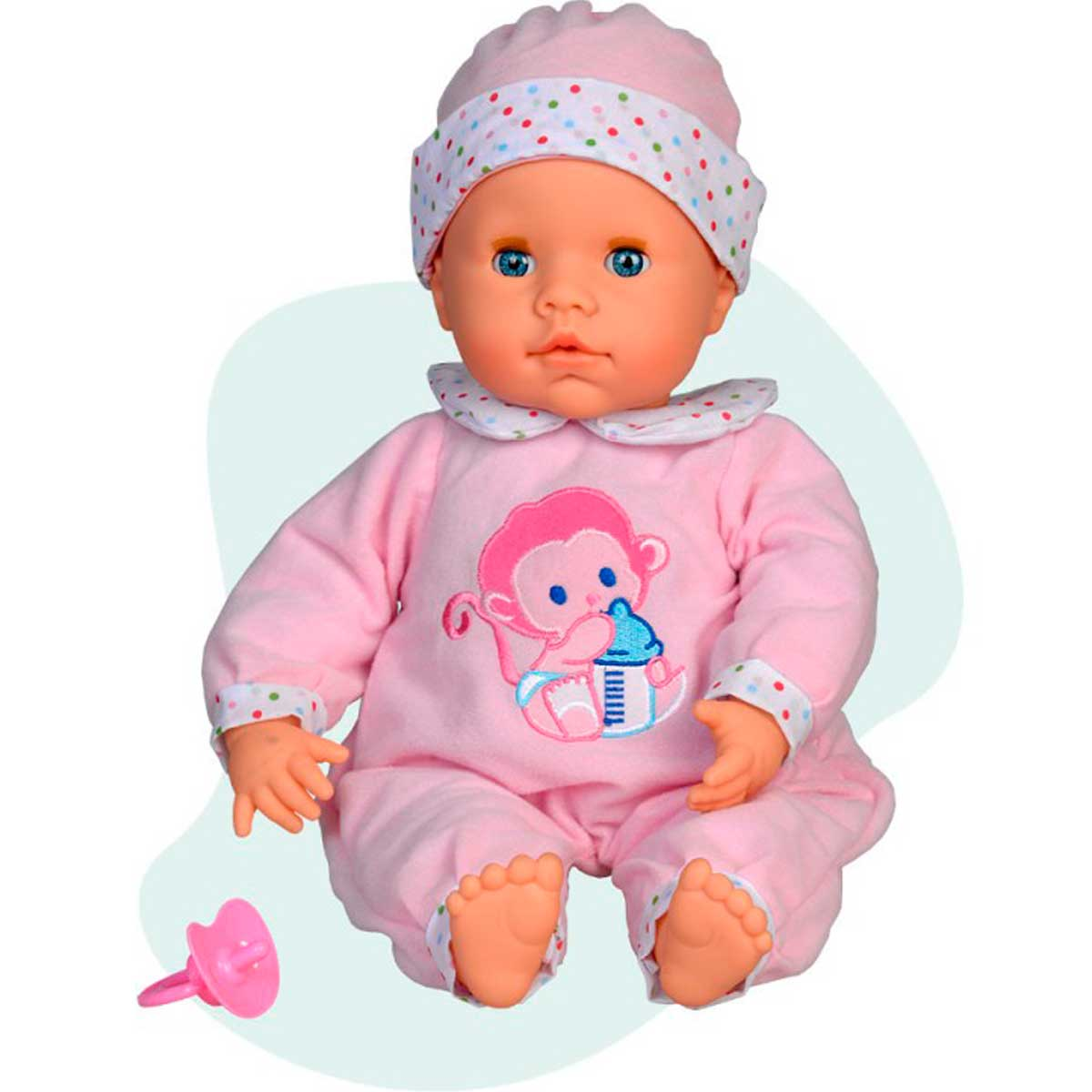 Una muñeca bebé con pijama y gorro rosa. Tiene ojos azules y un mono en el pecho. Un chupete rosa a la izquierda.
