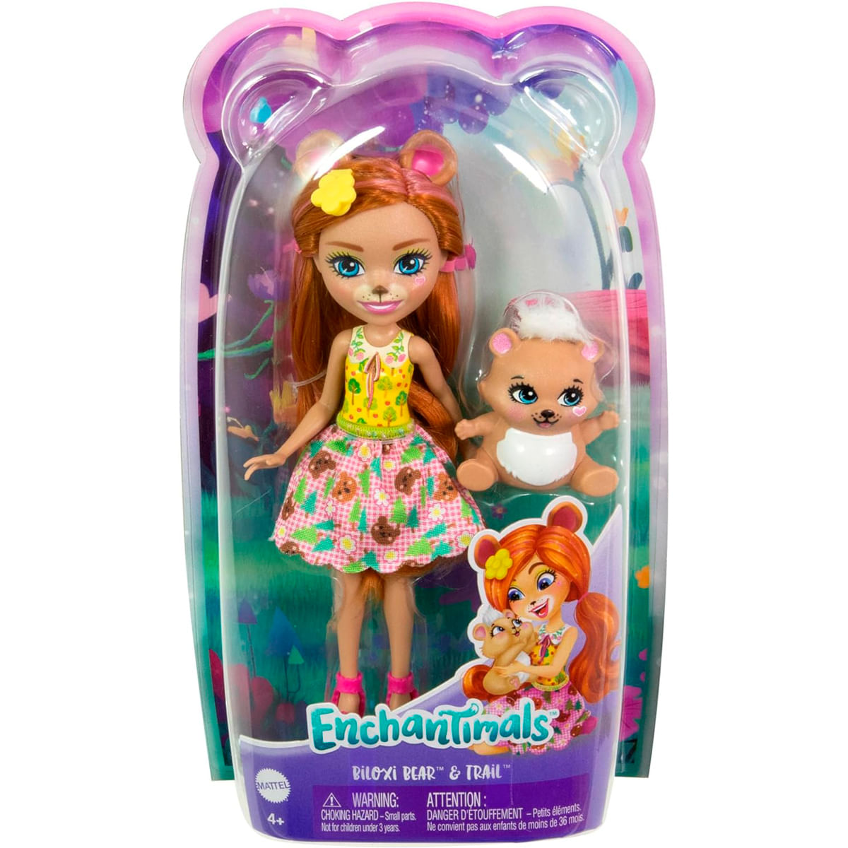Una muñeca en su embalaje. Es una Enchantimals Biloxi Bear, con una muñeca oso y un peluche de oso pequeño. Hay advertencias en la parte inferior.