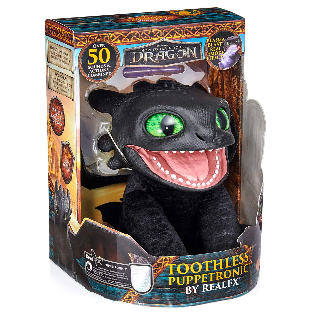 Un juguete Toothless puppetronic en su caja. Es negro con ojos verdes y la boca abierta. La caja tiene texto e imágenes.