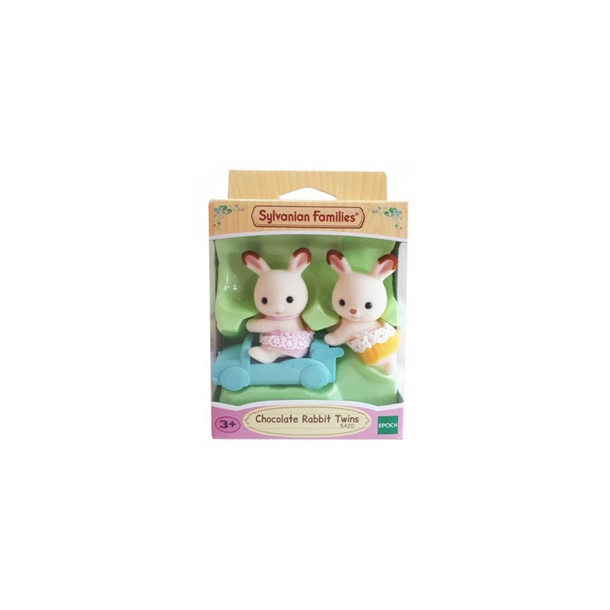 Due gemelli conigli giocattolo in una confezione. Indossano vestiti e sono in un'auto blu. La scatola dice 'Sylvanian Families' e 'Chocolate Rabbit Twins'.