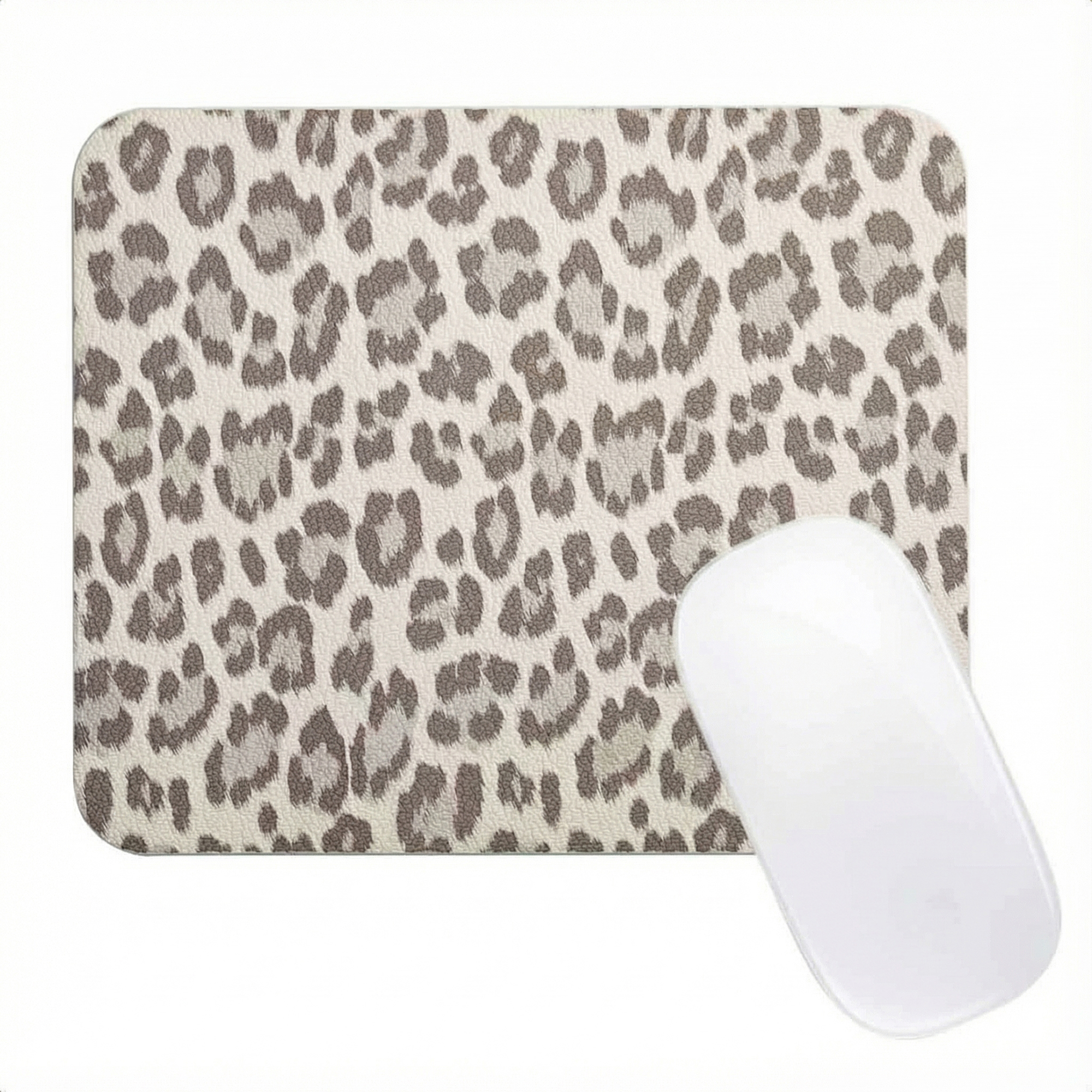 A mouse pad with a leopard print and a white mouse on a white background.