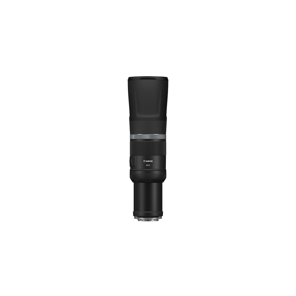 A Canon 800mm lens, black and silver, stands vertically against a white background. It's cylindrical with a hood and various rings.
