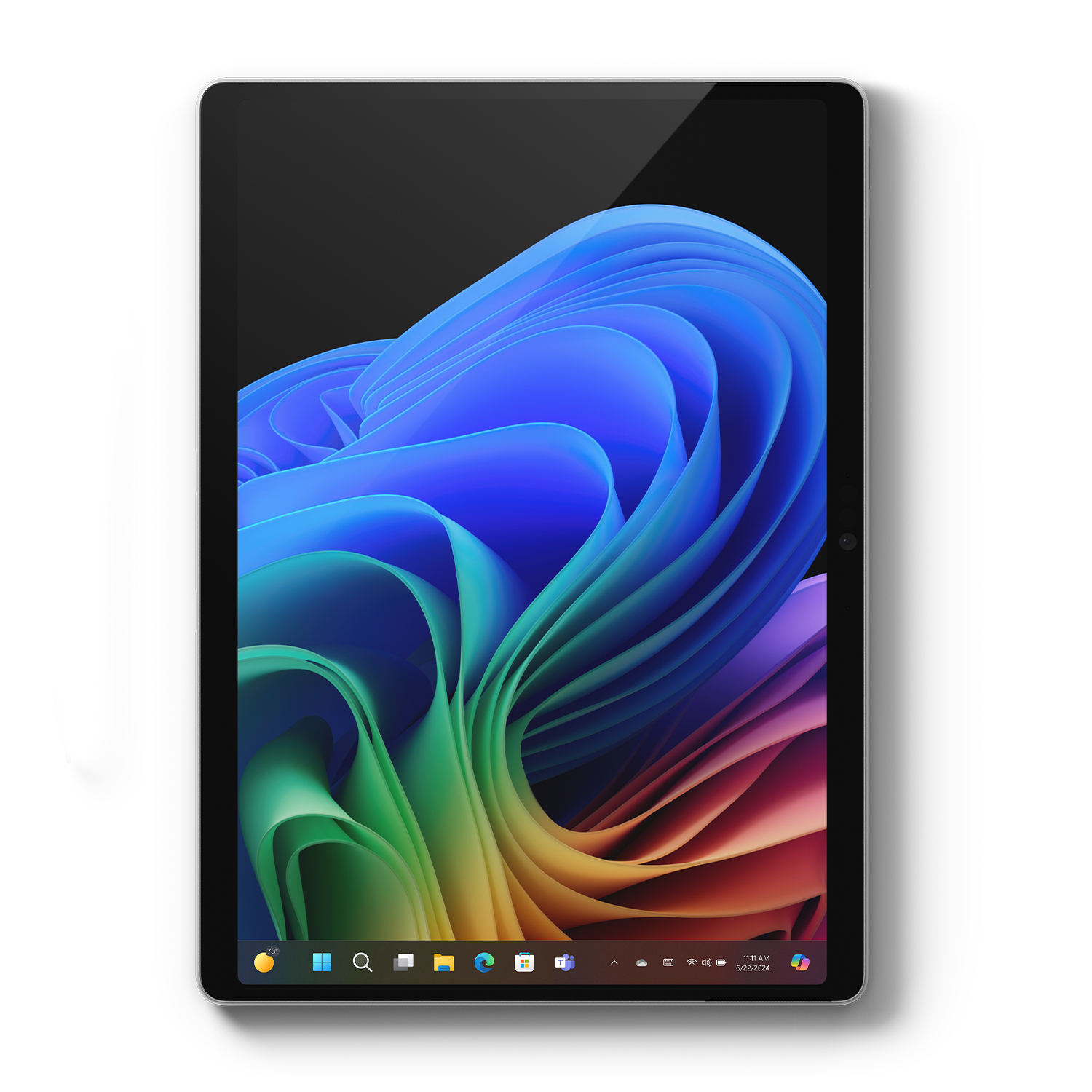 Tablet wyświetla kolorowy, abstrakcyjny obraz na ekranie. Interfejs na dole pokazuje ikony i datę.