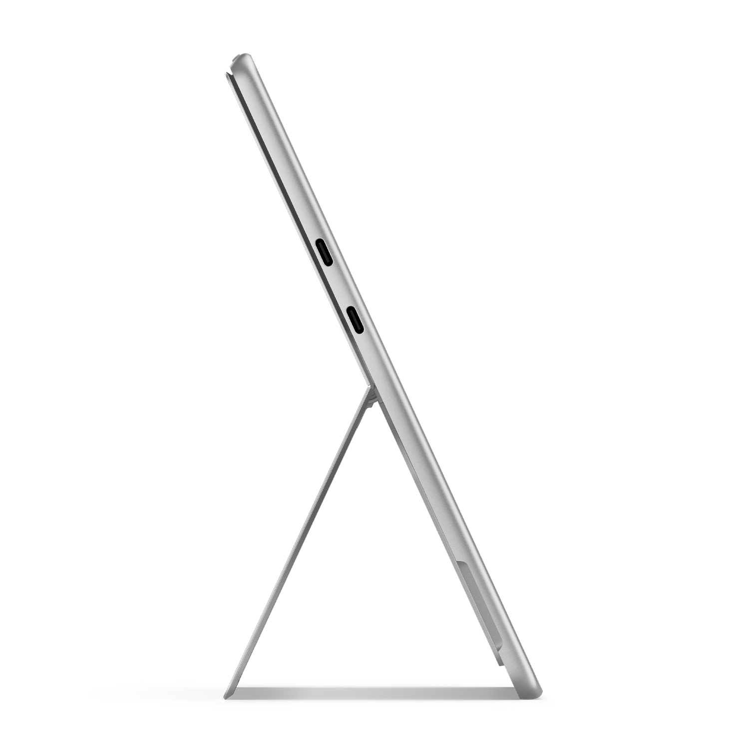 Srebrny tablet podparty podpórką. Ekran niewidoczny. Dwa porty widoczne z boku.