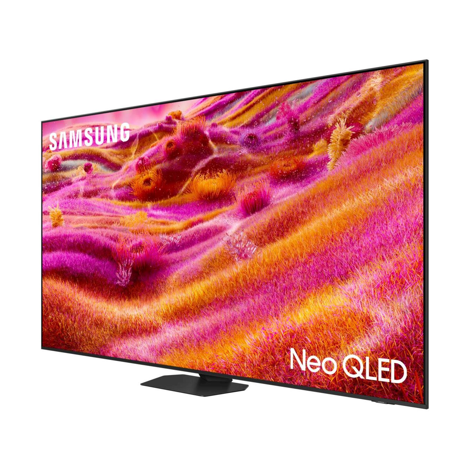 Un televisor Samsung Neo QLED muestra una imagen abstracta colorida. El televisor está en ángulo sobre un soporte negro. El logo Samsung es visible.