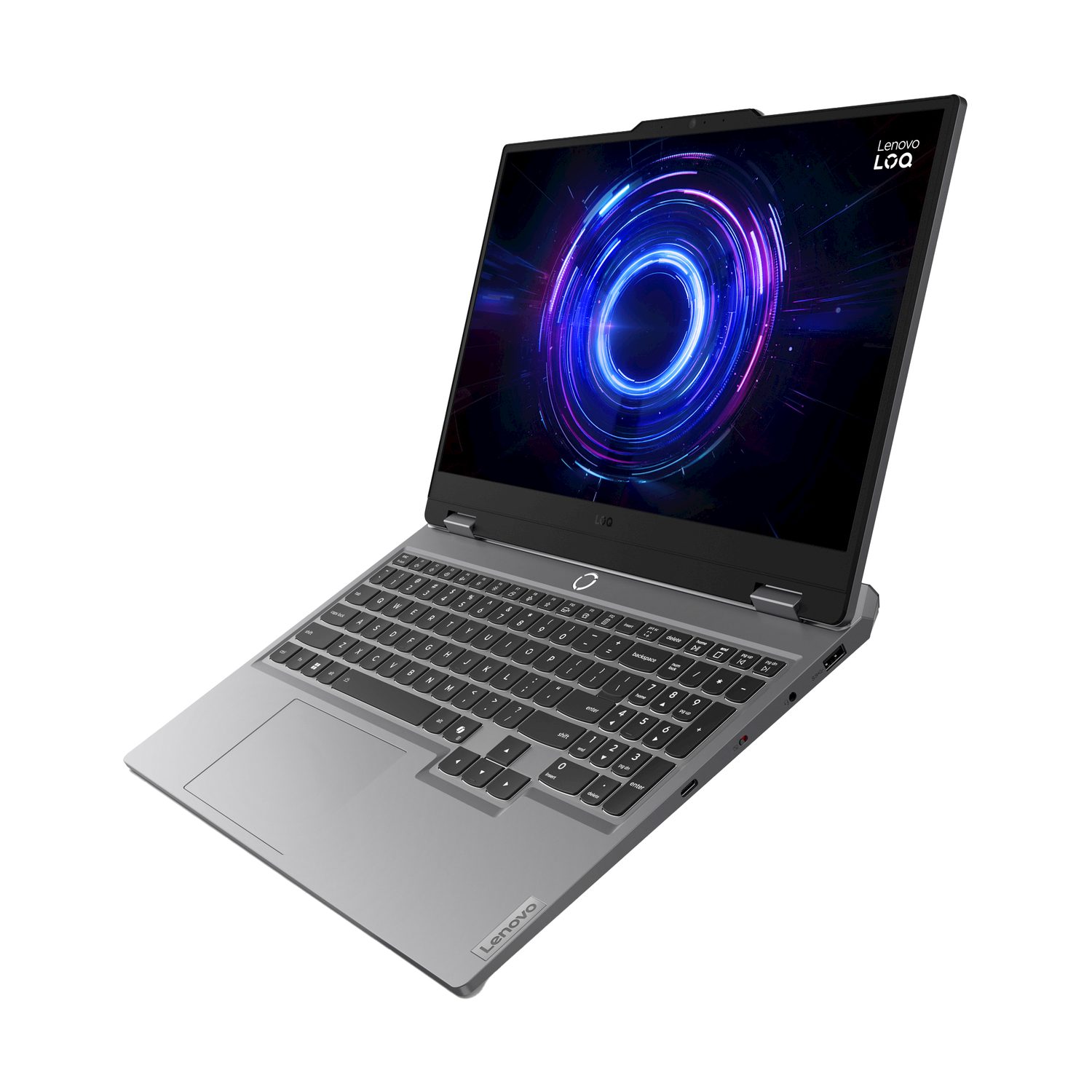 Un laptop grigio Lenovo LOQ è aperto, con uno schermo che mostra una grafica blu e viola. La tastiera è visibile.