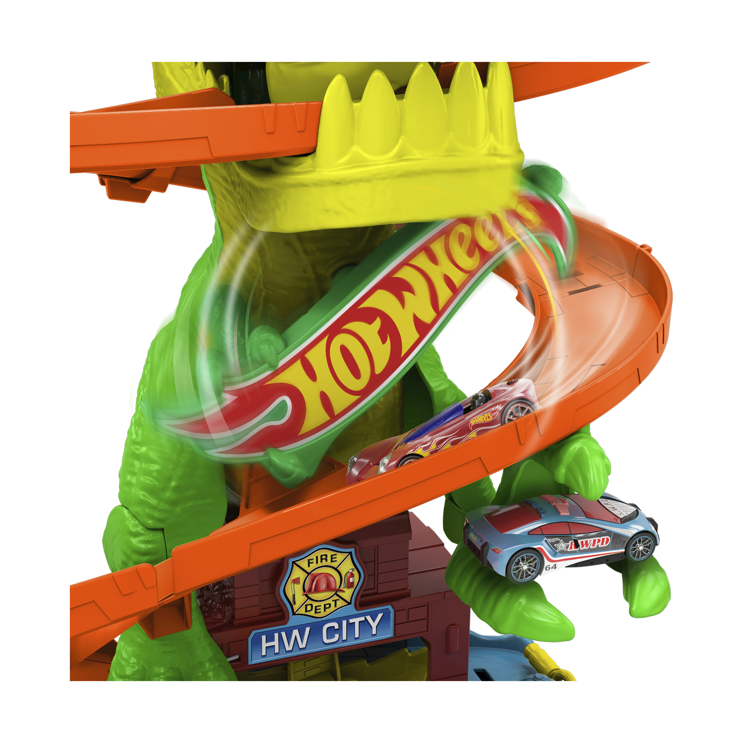 Ein Hot-Wheels-Spielset mit zwei Spielzeugautos, die eine orangefarbene Strecke hinunterrasen. Die Strecke ist Teil einer grünen Dinosaurier-Struktur.