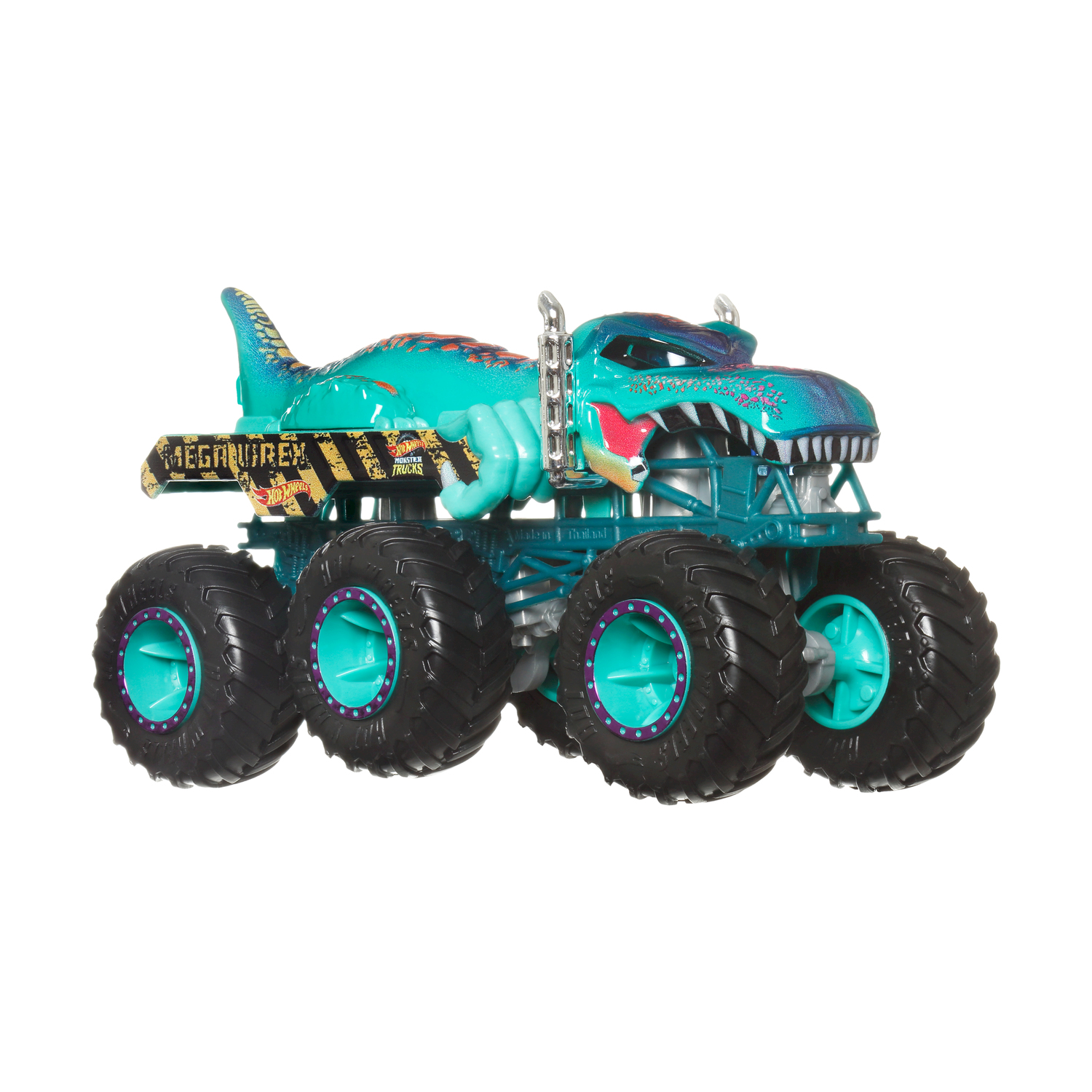 Zabawkowy monster truck, turkusowo-czarny, w kształcie dinozaura. Ma duże koła i napisy MEGAWREX oraz HOT WHEELS.