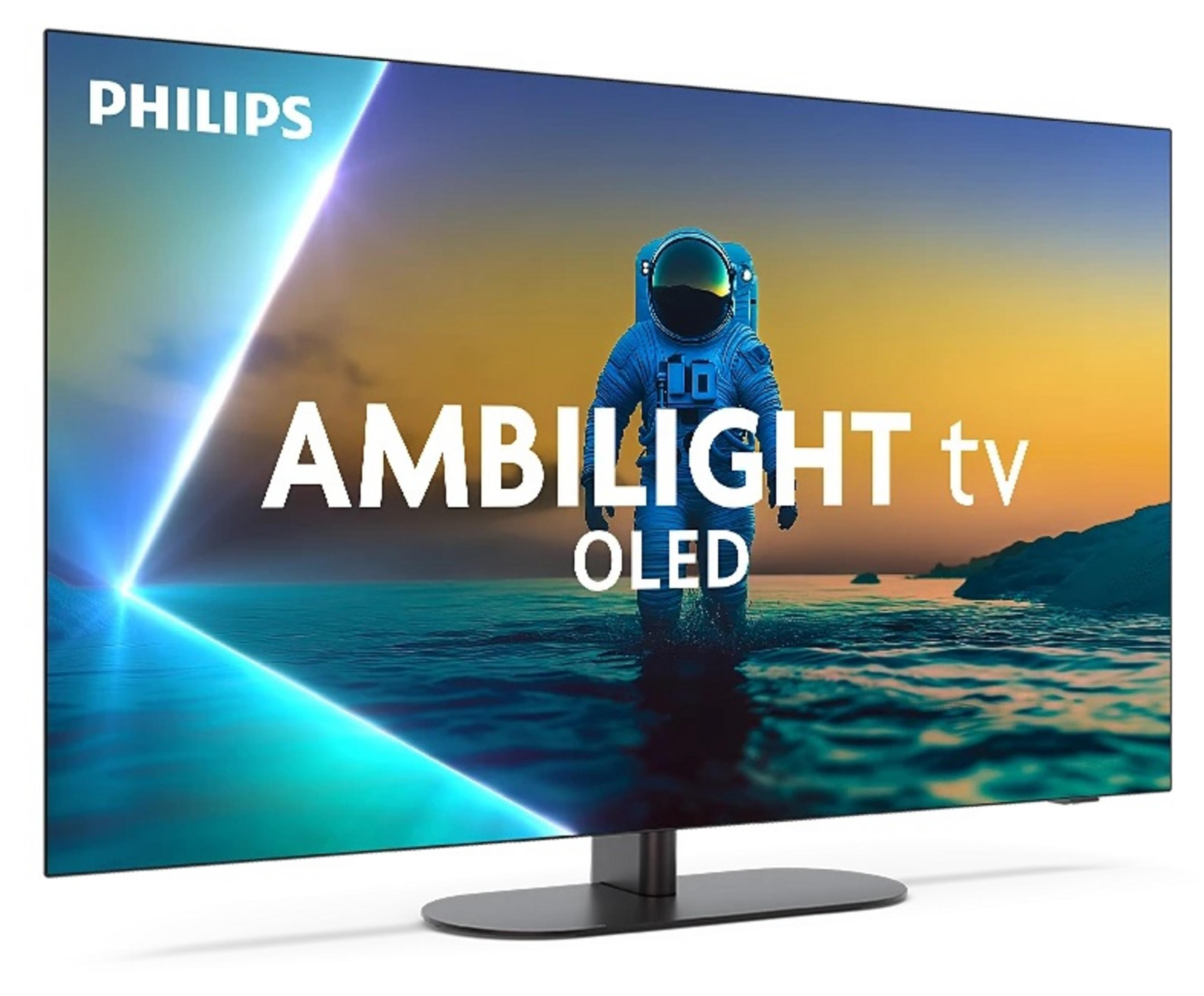 Telewizor Philips Ambilight OLED. Kosmonauta stoi w wodzie, widoczne są słowa Ambilight tv OLED. Tłem jest zachód słońca.