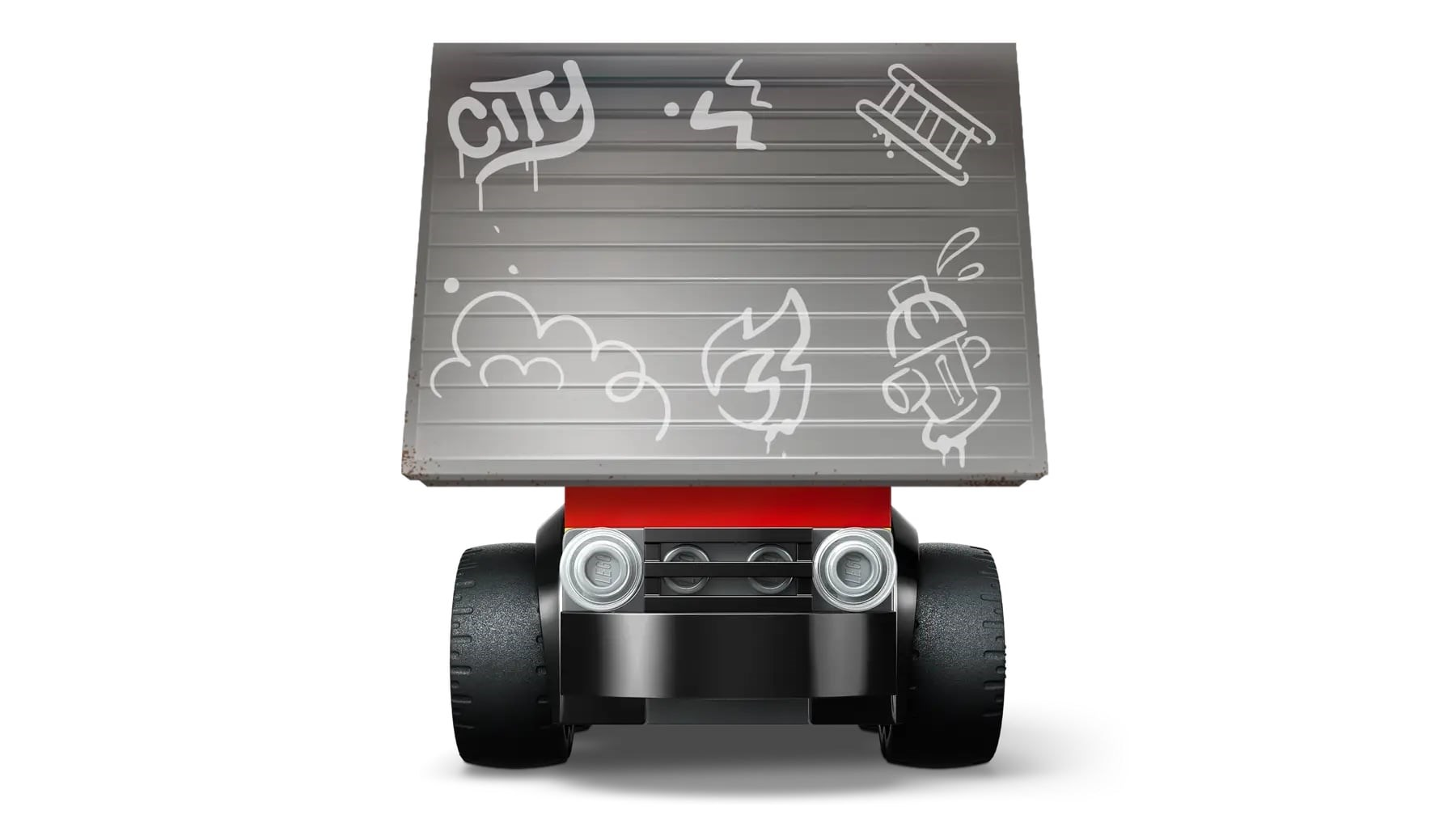 Zabawkowy samochód z szarym dachem z graffiti. Samochód ma czarne koła, czerwoną podstawę i czarny przód.