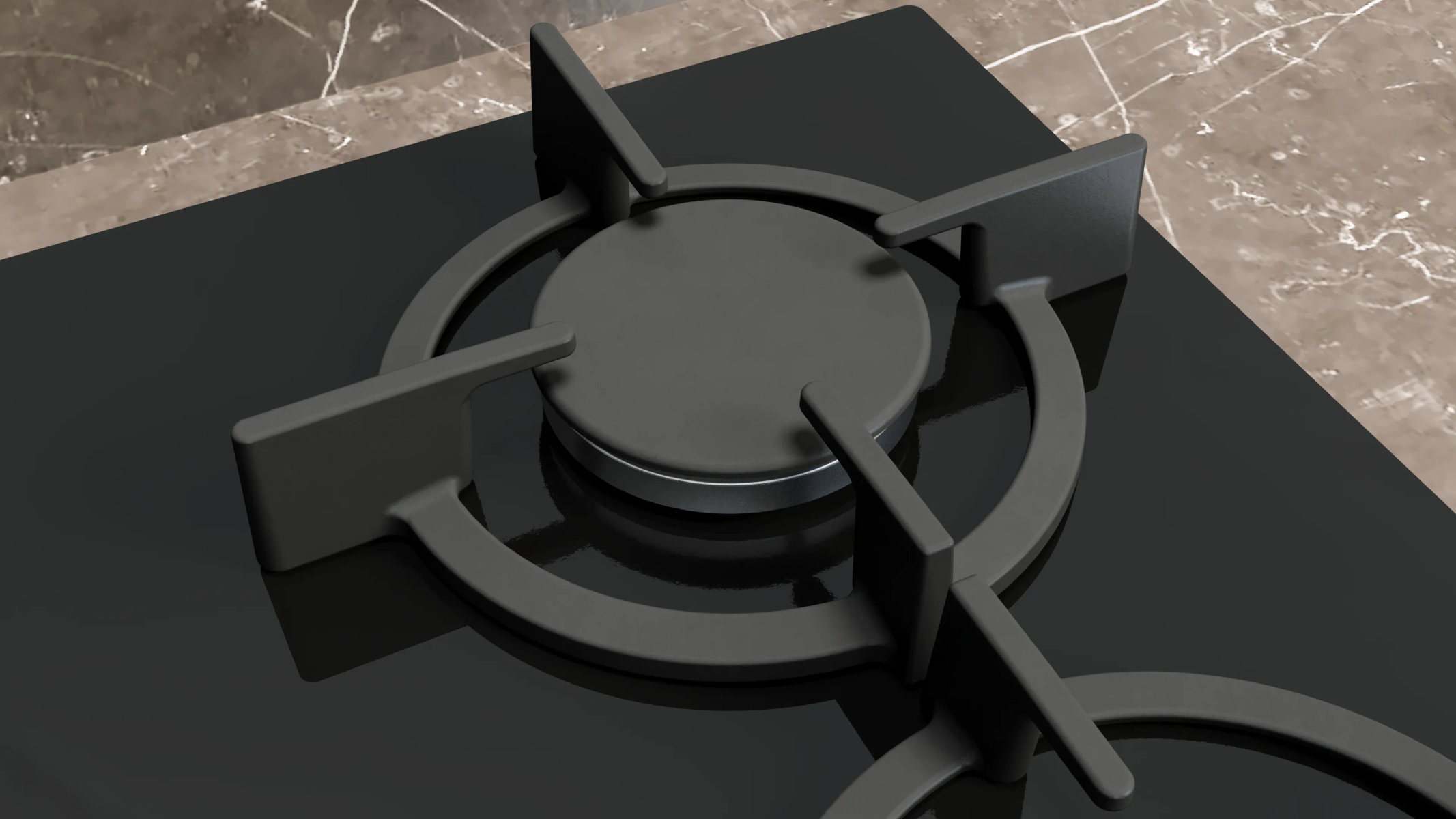 Primo piano di un bruciatore per fornelli a gas nero con un design circolare. Piano di lavoro in marmo sullo sfondo.