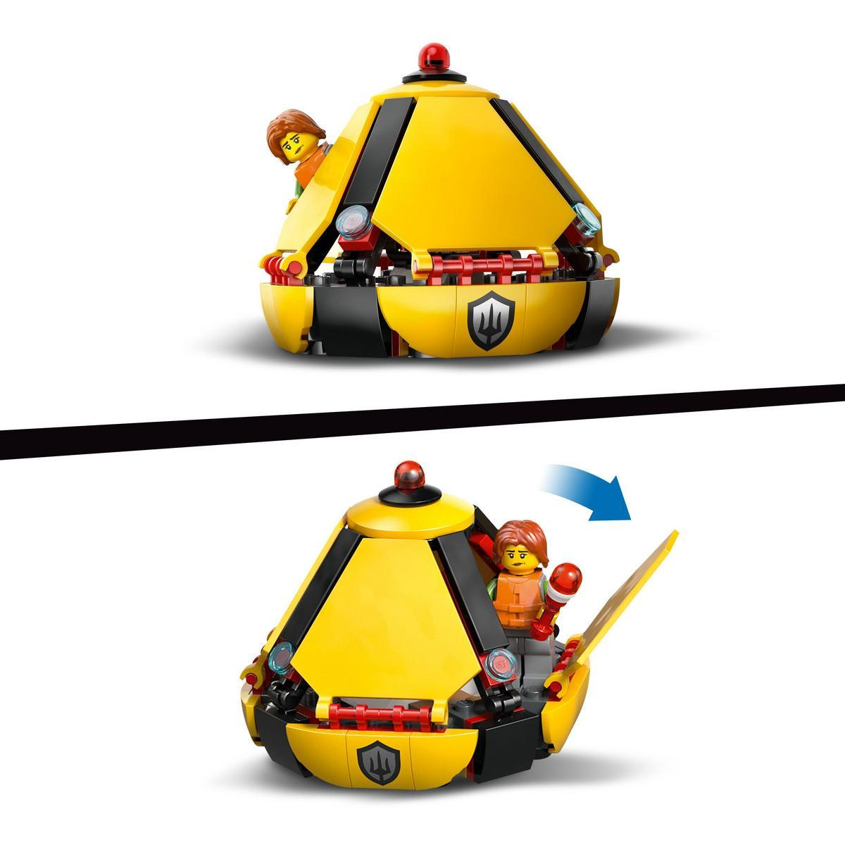 Zestaw Lego z żółtą i czarną konstrukcją, dwie figurki Lego. Jedna figurka jest w środku, druga częściowo widoczna od góry.