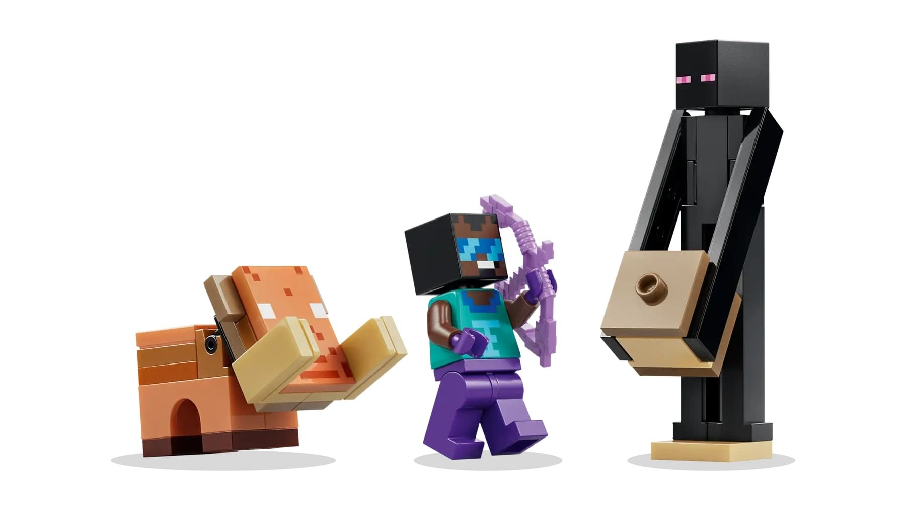 Zestaw Lego Minecraft: Świnia, Steve z łukiem i Enderman. Świnia jest pomarańczowa. Steve nosi niebieskie okulary. Enderman jest czarny.
