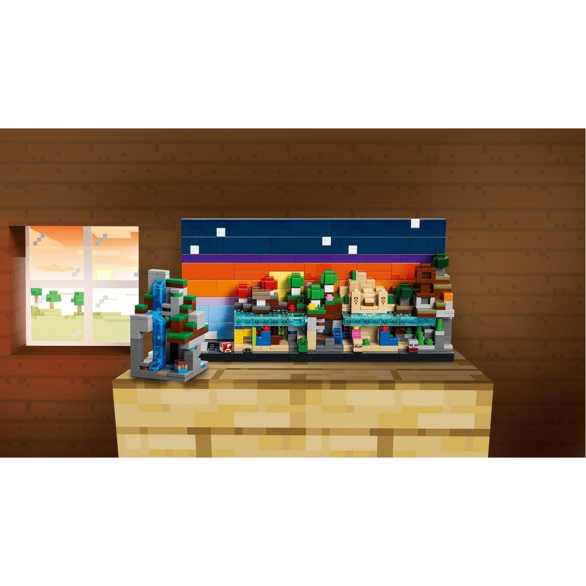 Diorama Minecraft na drewnianym klocku. Ma wodospad, drzewa i tło zachodu słońca. Okno pokazuje pikselowy krajobraz.