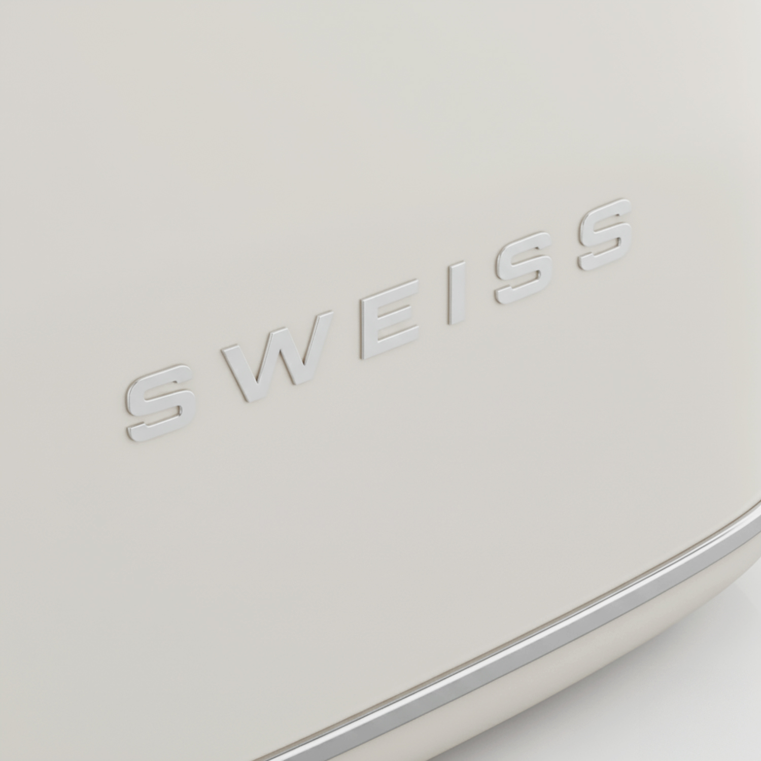 Cremefarbenes Gerät mit silberfarbenem Schriftzug 'SWISS'. Unten silberne Zierleiste, weißer Hintergrund.