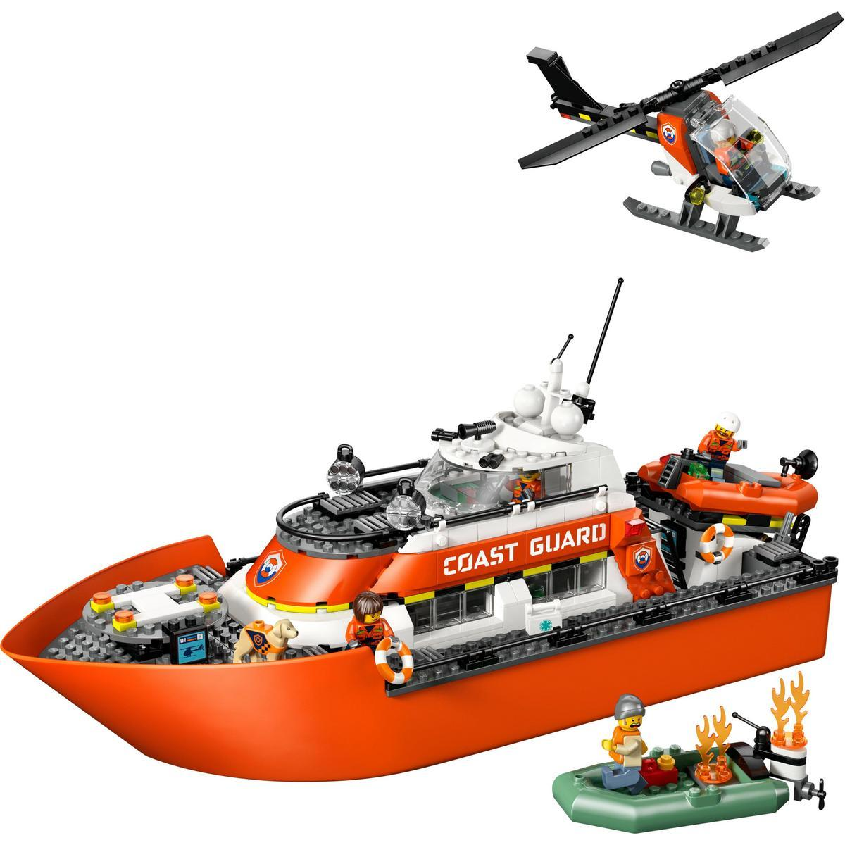 Zestaw Lego Straży Przybrzeżnej z pomarańczową łodzią, helikopterem i tratwą ratunkową. W zestawie figurki.