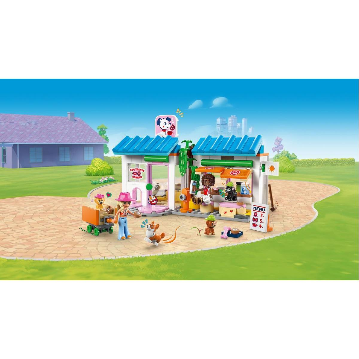 Kolorowa piekarnia dla psów z figurkami, psami i smakołykami. Kobieta w różowym kapeluszu wchodzi w interakcję ze sceną.
