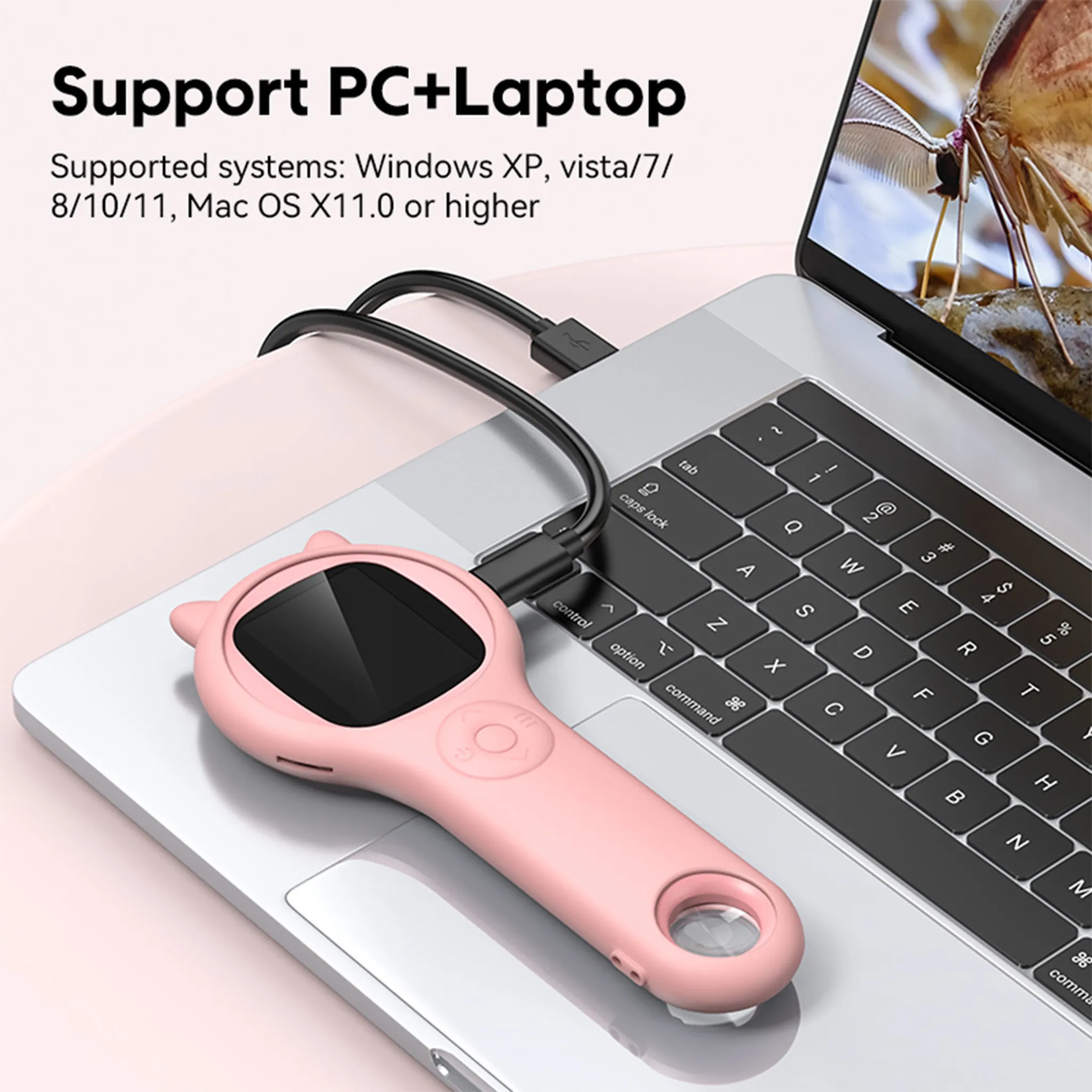 Ein rosa Gerät, das mit einem Laptop verbunden ist. Die Laptop-Tastatur ist sichtbar. Oben steht: Support PC+Laptop.