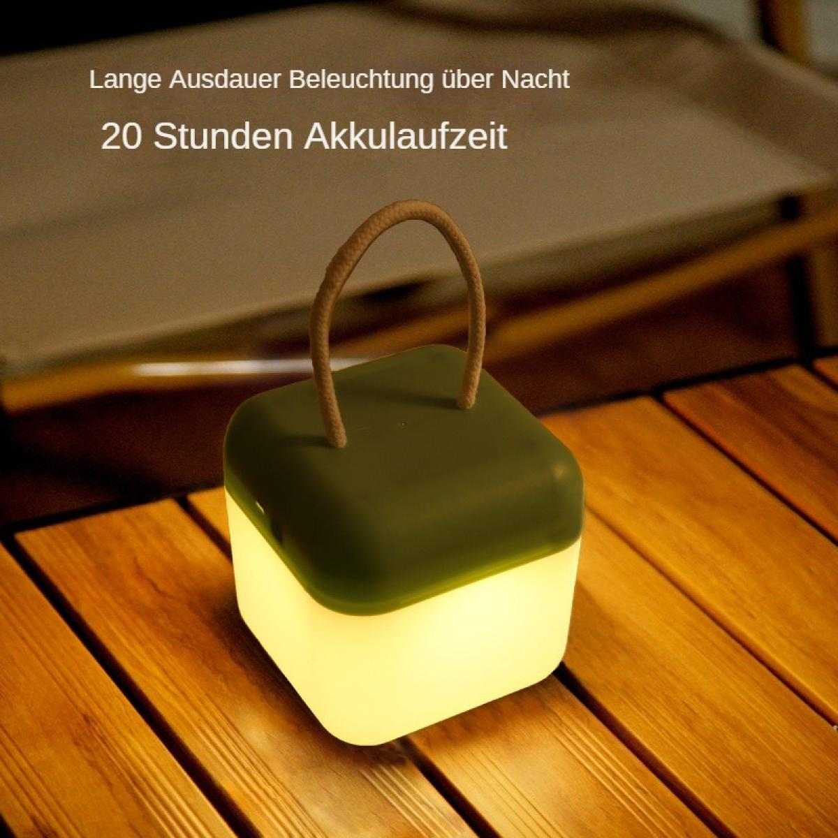 Eine leuchtende grün-weiße Laterne mit Seilgriff steht auf einem Holztisch. Der Text oben lautet: langlebige Nachtbeleuchtung.