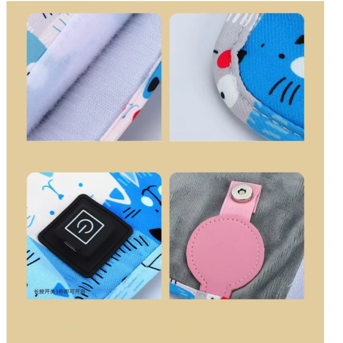 Das Bild zeigt Nahaufnahmen eines blau gemusterten Heizkissens mit Katzenmuster. Es hat einen Power-Knopf, einen rosa Riemen mit Druckknopf und ein weiches, graues Innenteil.
