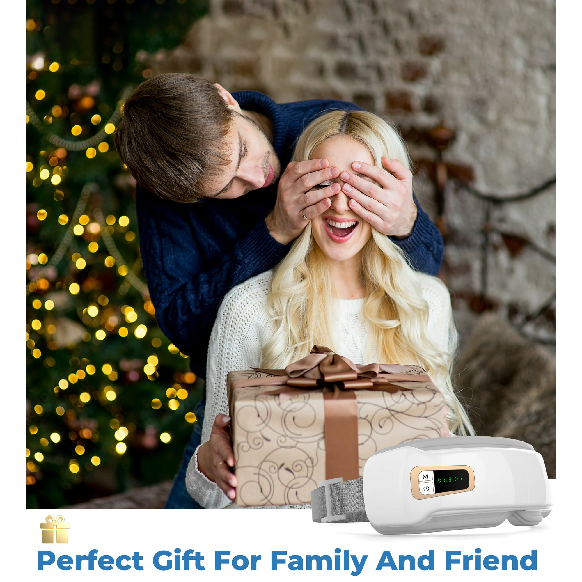 Ein Mann bedeckt die Augen einer Frau mit seinen Händen. Die Frau hält eine Geschenkbox. Rechts ist ein weißes Augenmassagegerät.