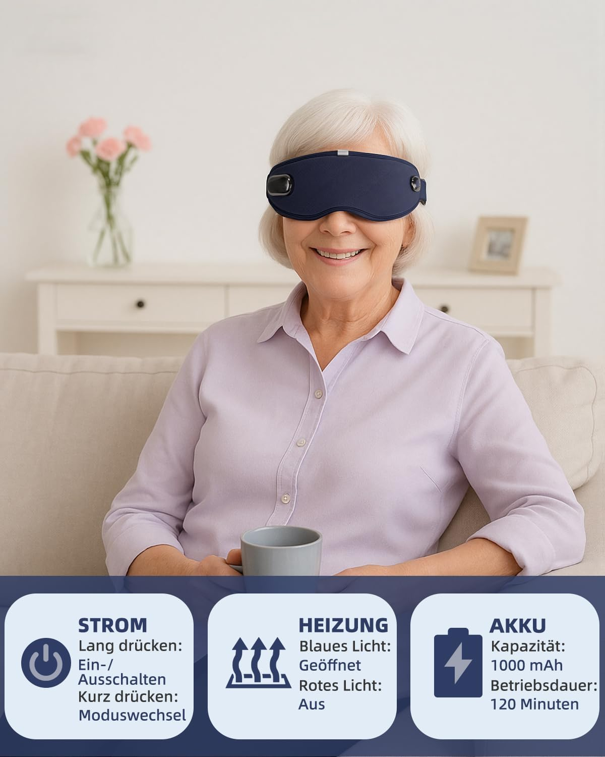 Eine ältere Frau mit einer dunkelblauen Augenmaske, lächelnd, sitzt auf einem Sofa. Text unten beschreibt Leistung, Heizung und Batterieinfo.
