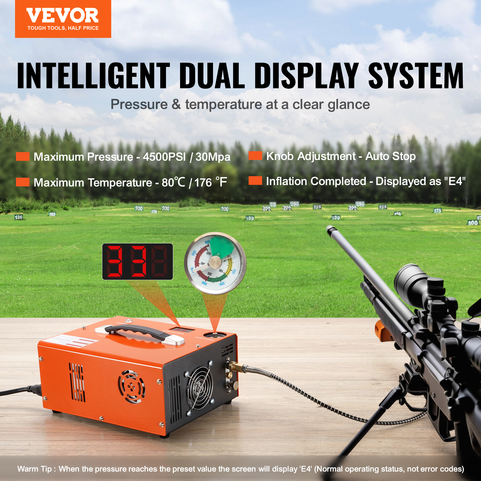 Ein orangefarbener Luftkompressor mit Digitalanzeige, Manometer und Luftgewehr im Vordergrund. Grünes Feld im Hintergrund.