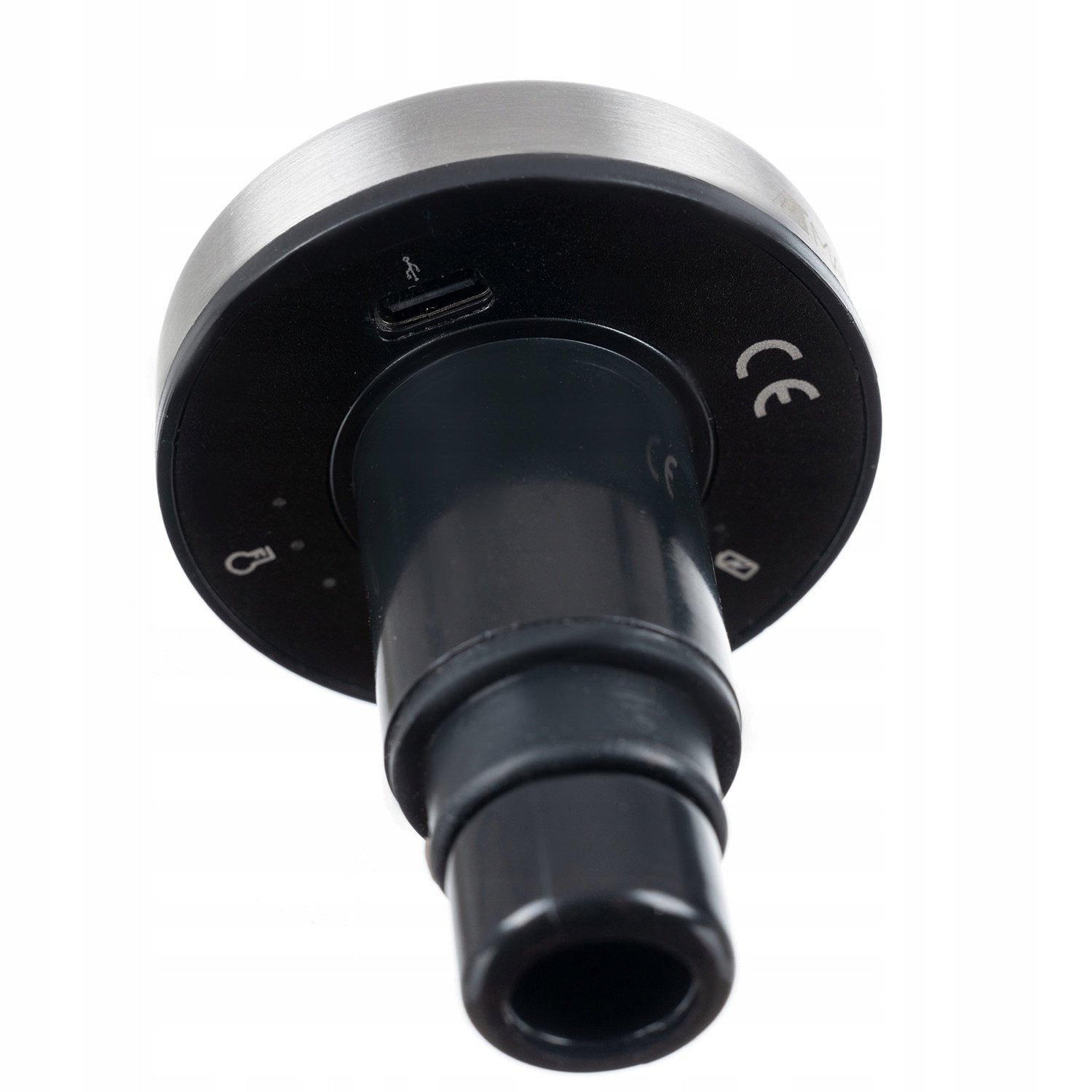 Vista de cerca de un dispositivo negro y plateado, posiblemente un instrumento médico, con diseño cilíndrico y puerto USB.
