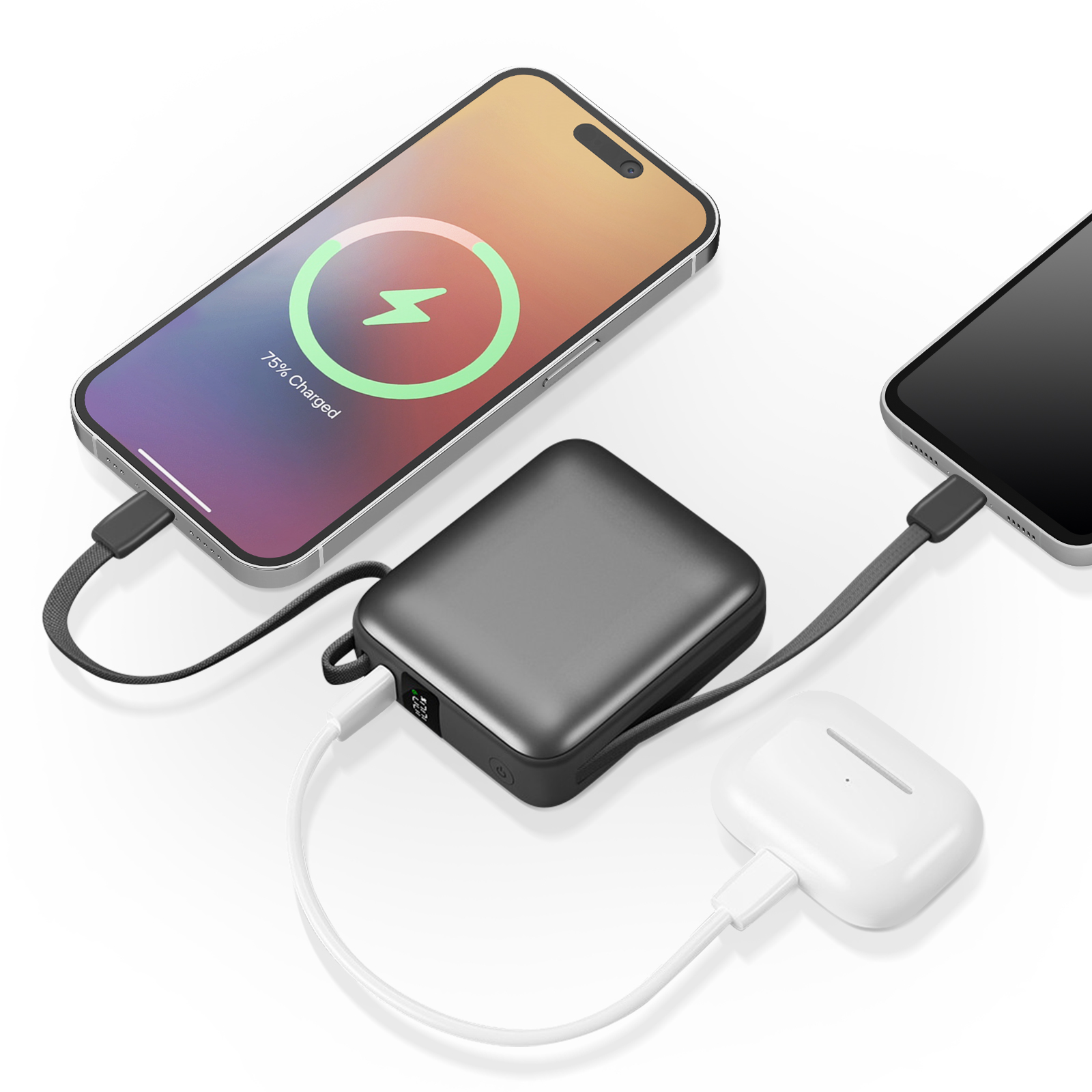Téléphones en charge via une batterie externe. Un téléphone affiche 75% de charge. Les écouteurs sont également en charge.