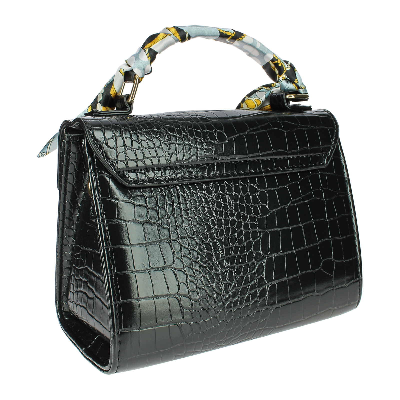 Un bolso negro con textura de cocodrilo y una bufanda estampada en el asa, sobre fondo blanco.