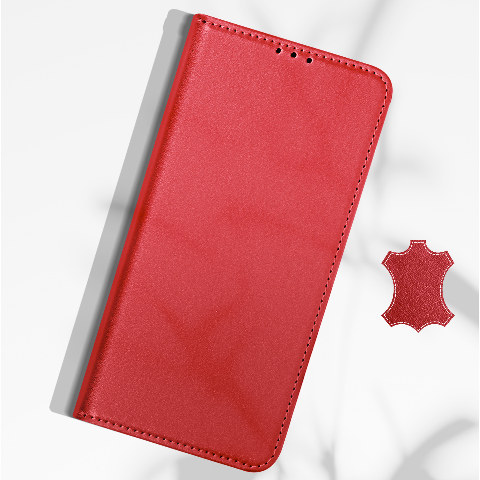 Custodia per telefono in pelle rossa con bordi cuciti e simbolo in pelle su sfondo bianco. Ombre visibili.