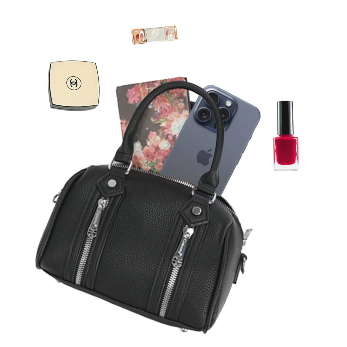 Un bolso de cuero negro con cremalleras plateadas, un teléfono, esmalte de uñas, una polvera y lápiz labial sobre fondo blanco.