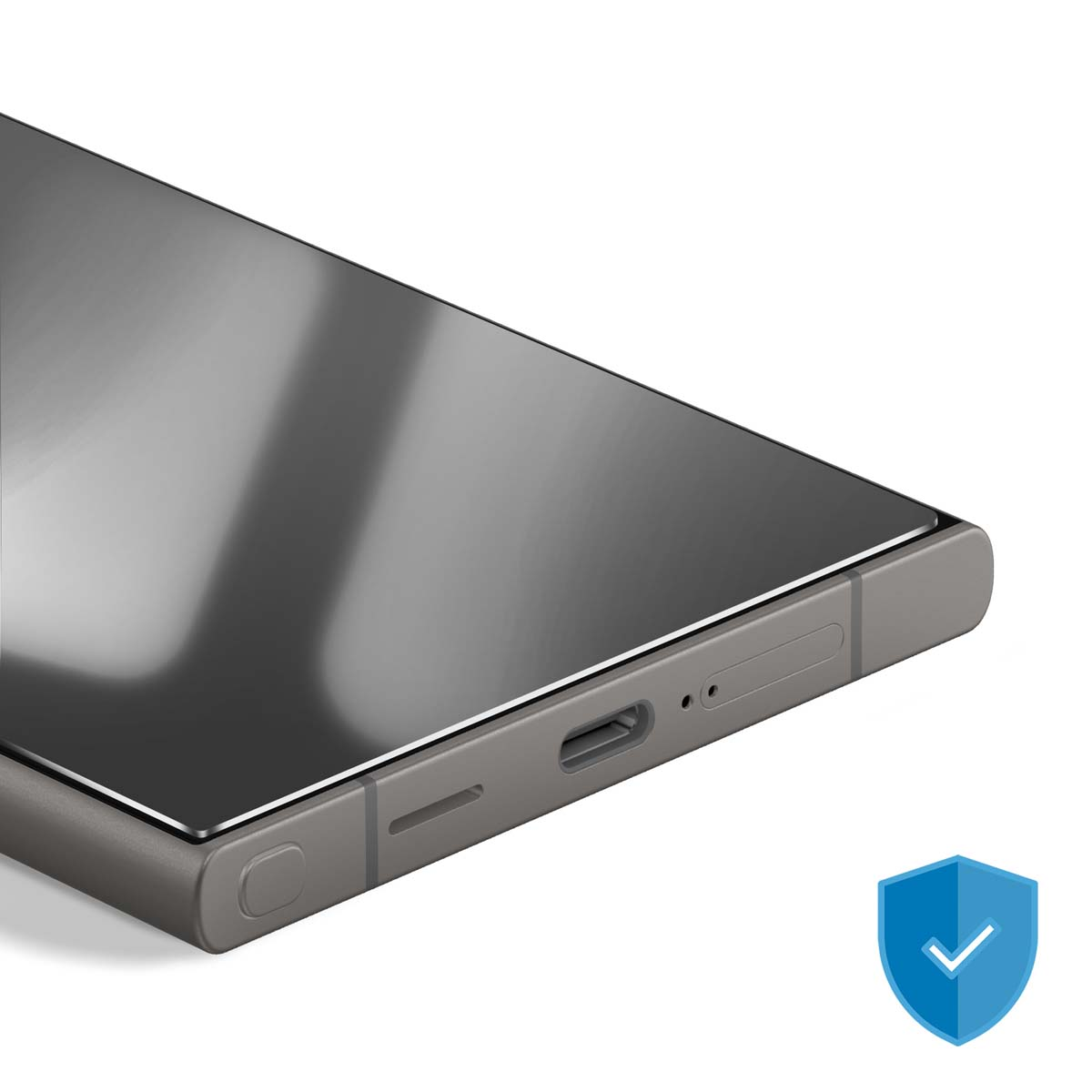Primo piano di uno smartphone con protezione schermo. Il telefono è grigio, lo schermo riflettente. Icona scudo blu nell'angolo.