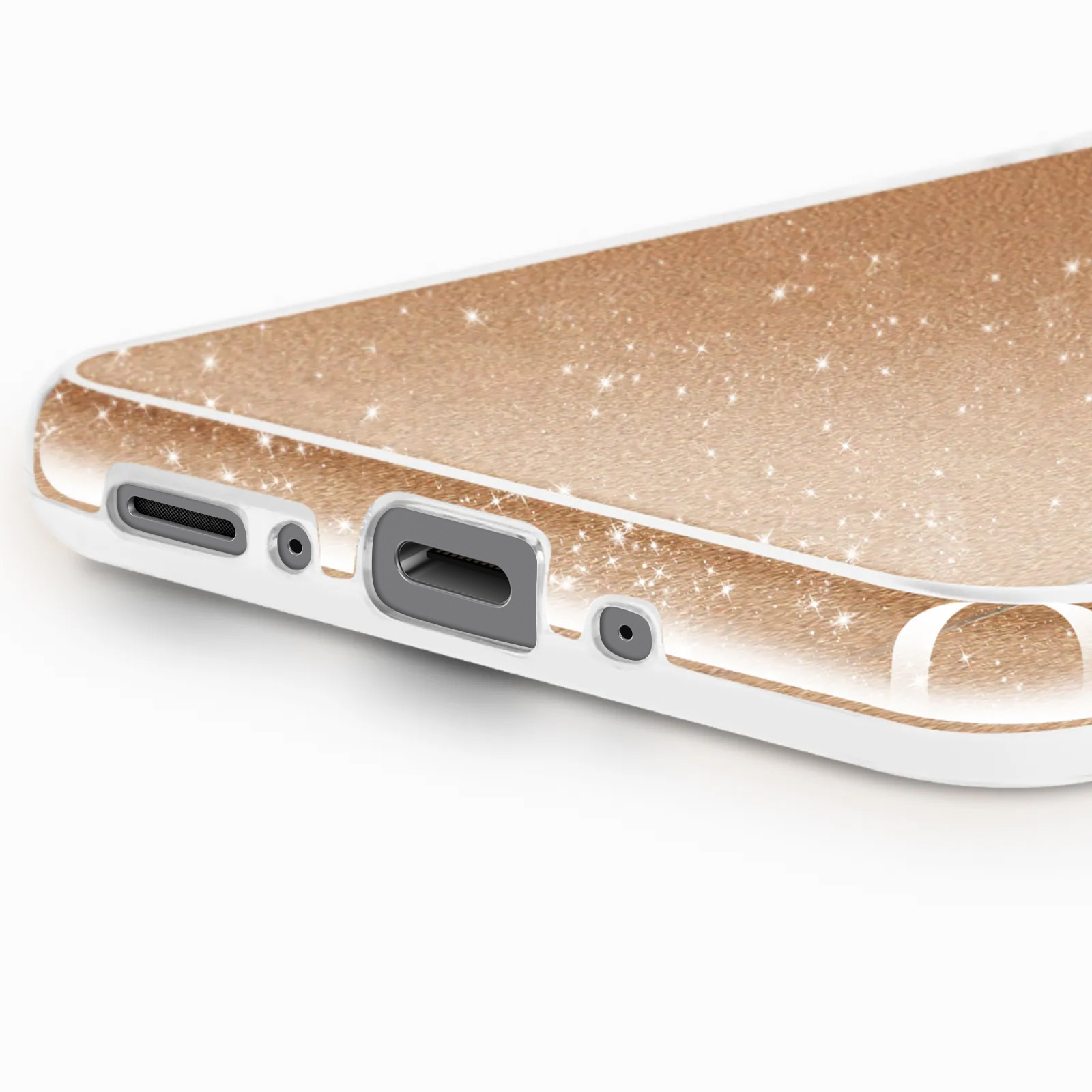 Gros plan sur une coque de téléphone. Cadre blanc, intérieur doré scintillant. Diverses ouvertures sont visibles.