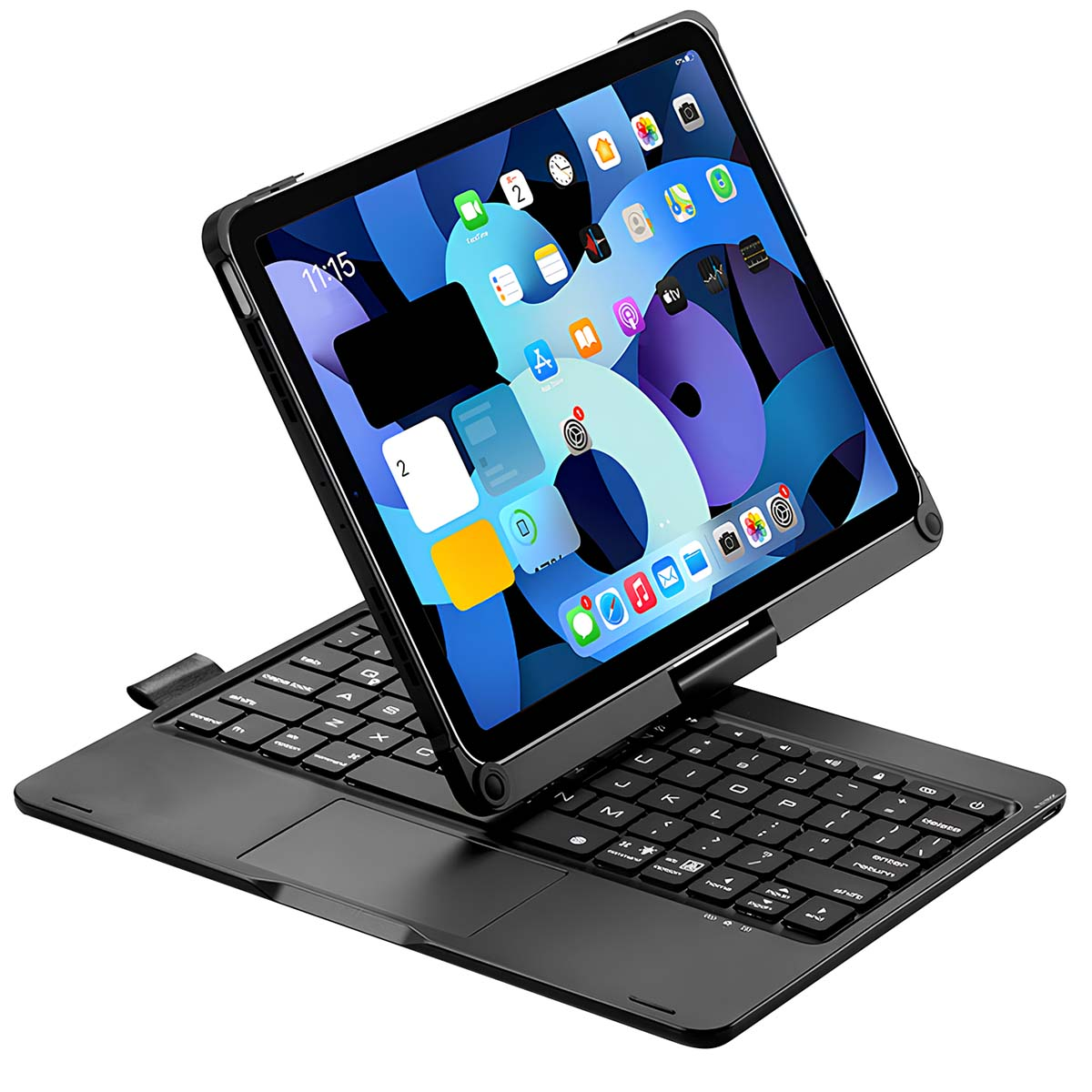Una tableta con teclado negro está abierta, mostrando la pantalla de inicio con iconos de aplicaciones. La hora es 11:15.