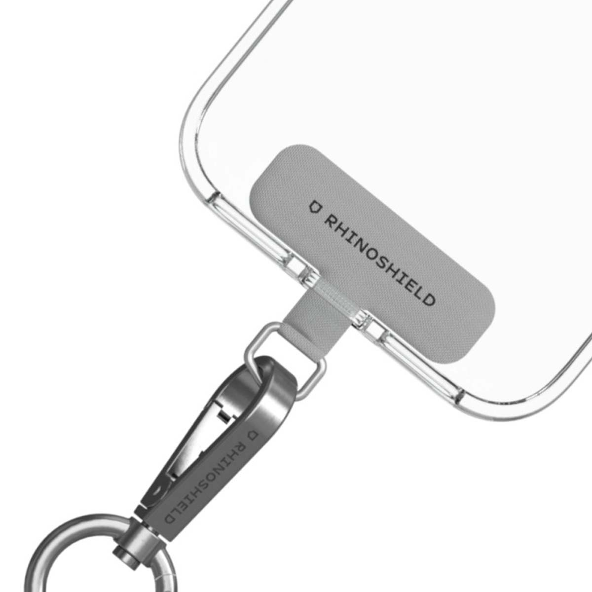 Una custodia trasparente per telefono con cinturino grigio e moschettone argentato. Il cinturino grigio ha il marchio RHINOSHIELD.