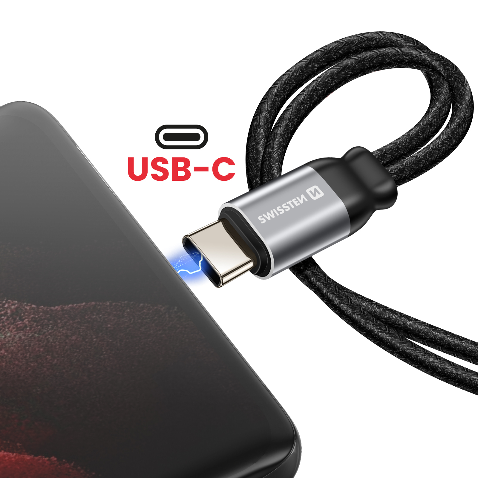 Cavo USB-C collegato a un telefono. Il cavo è nero e argento, il telefono è nero. Testo: USB-C.