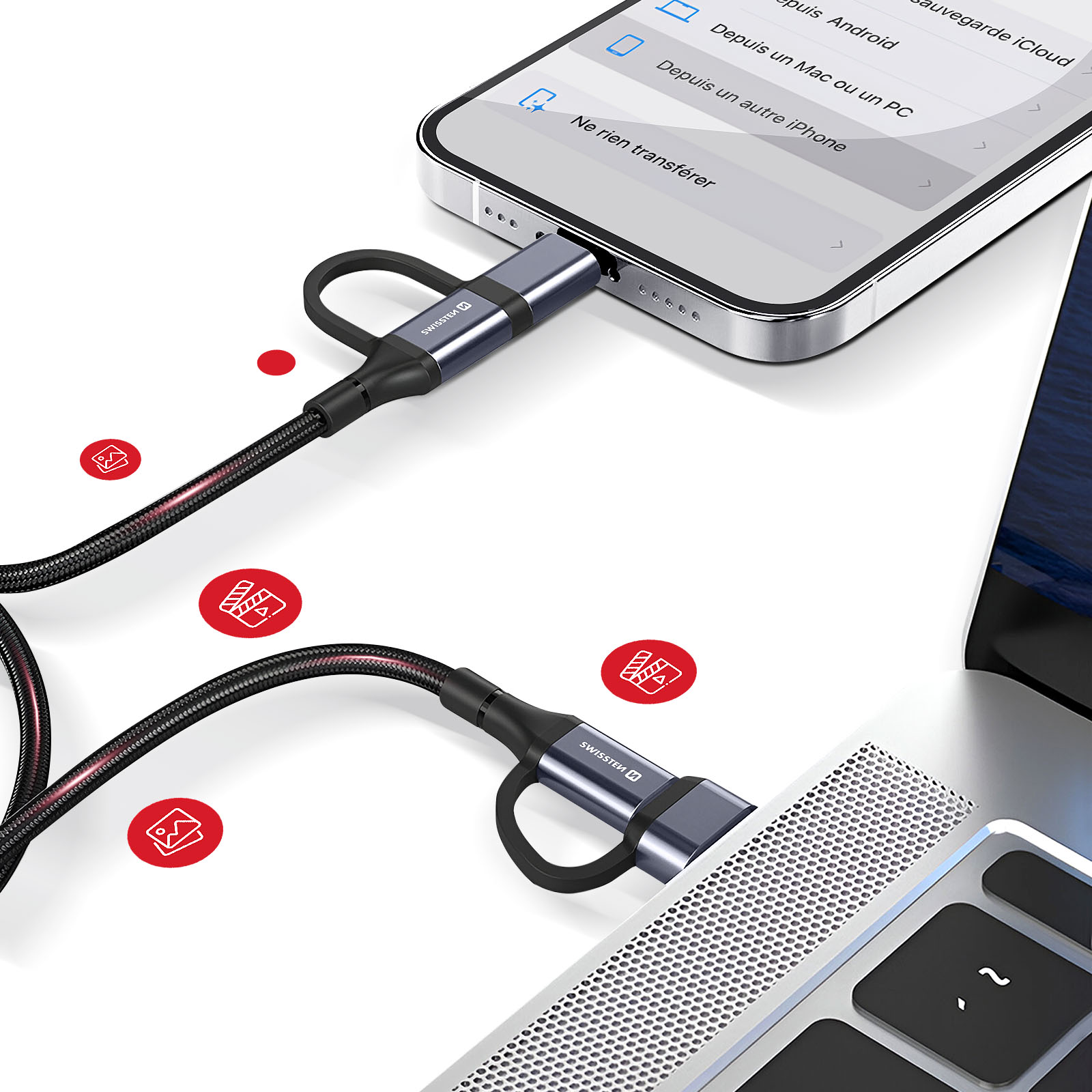 Ein Telefon ist über ein schwarz-rotes USB-Kabel mit einem Laptop verbunden. Das Kabel hat einen Metallstecker.