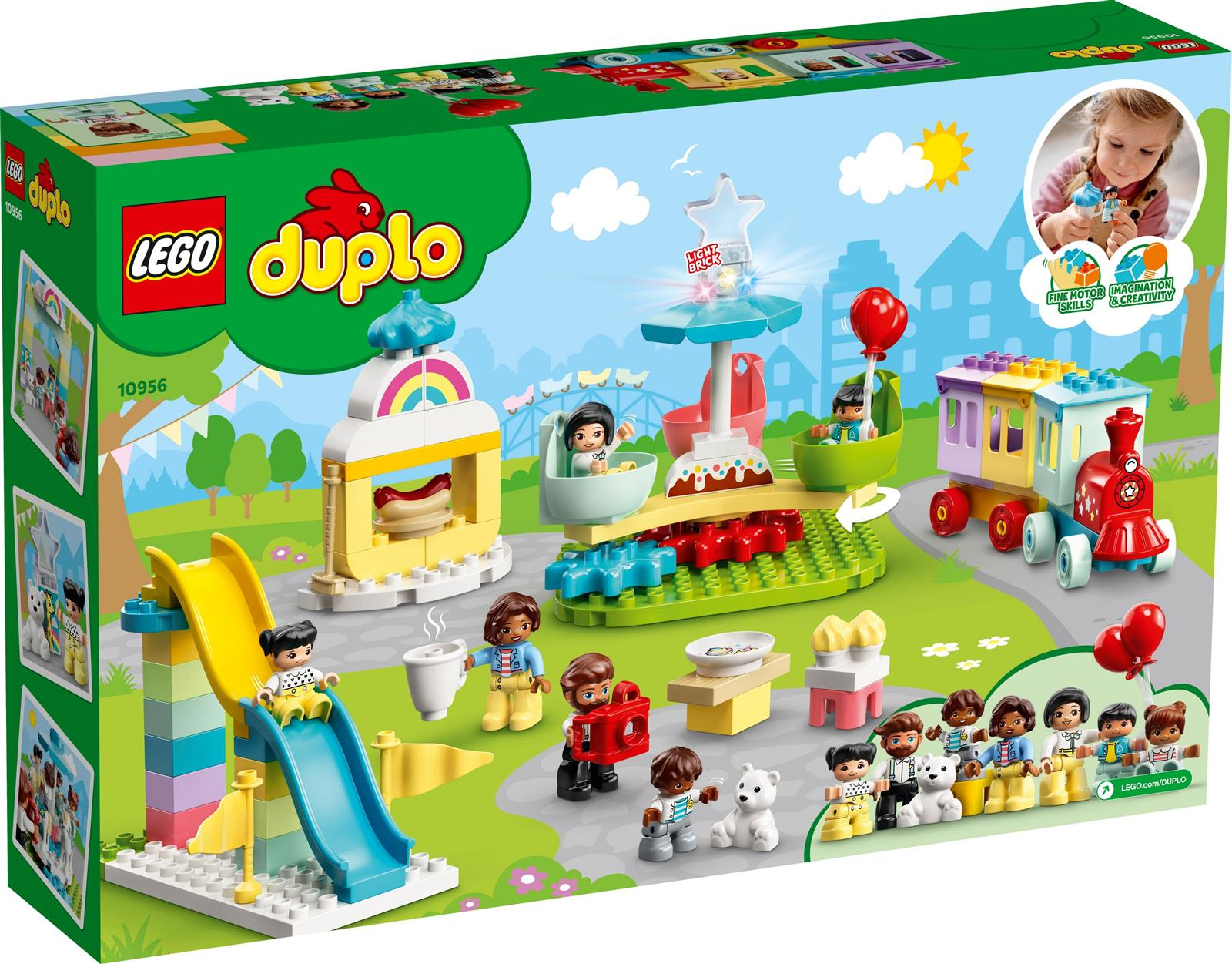 Ein LEGO Duplo Set zeigt eine Szene eines Vergnügungsparks mit Rutsche, Zug, Riesenrad und verschiedenen Figuren.